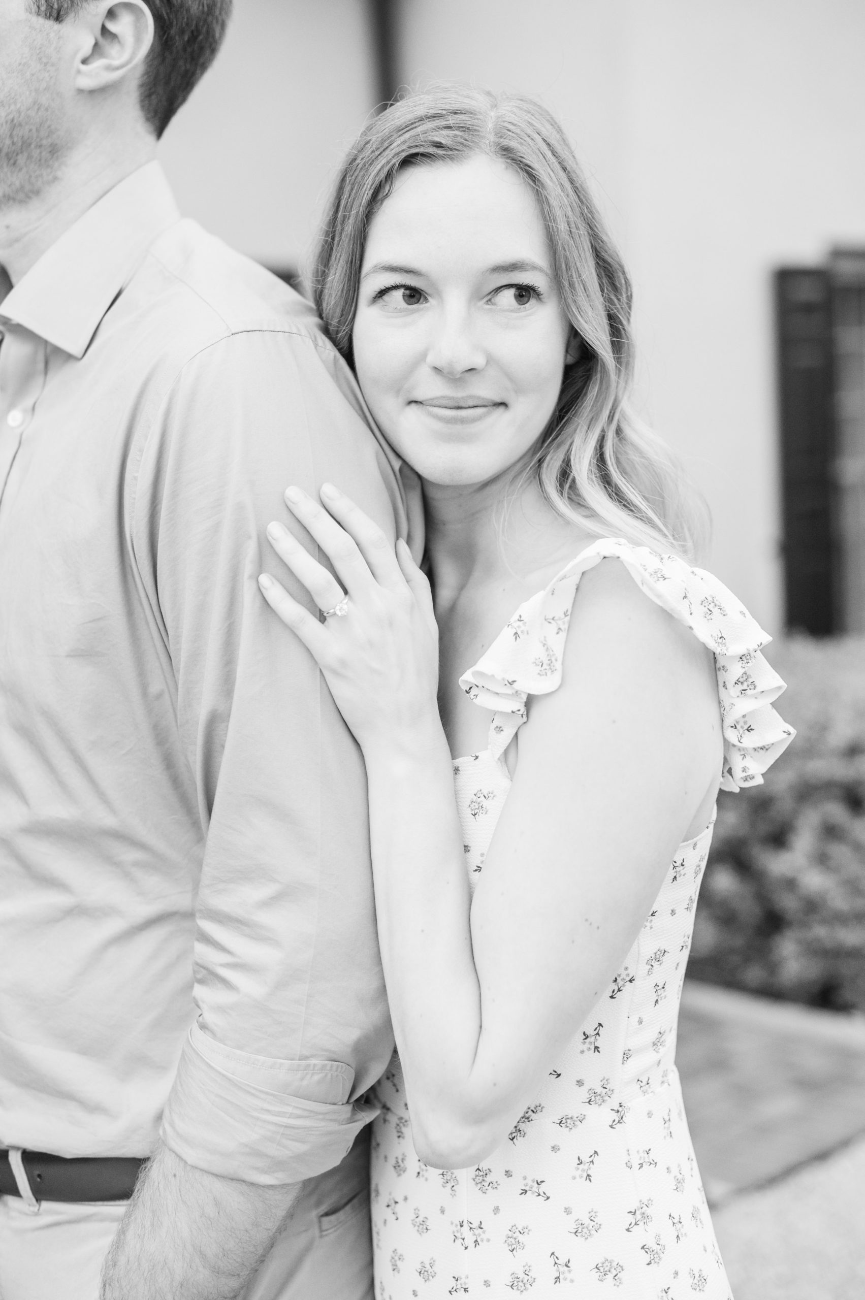 Engaged Couple poses on the lawn at Belmont Manor during a rainy sunset engagement photographed by Baltimore Wedding Photographer Cait Kramer