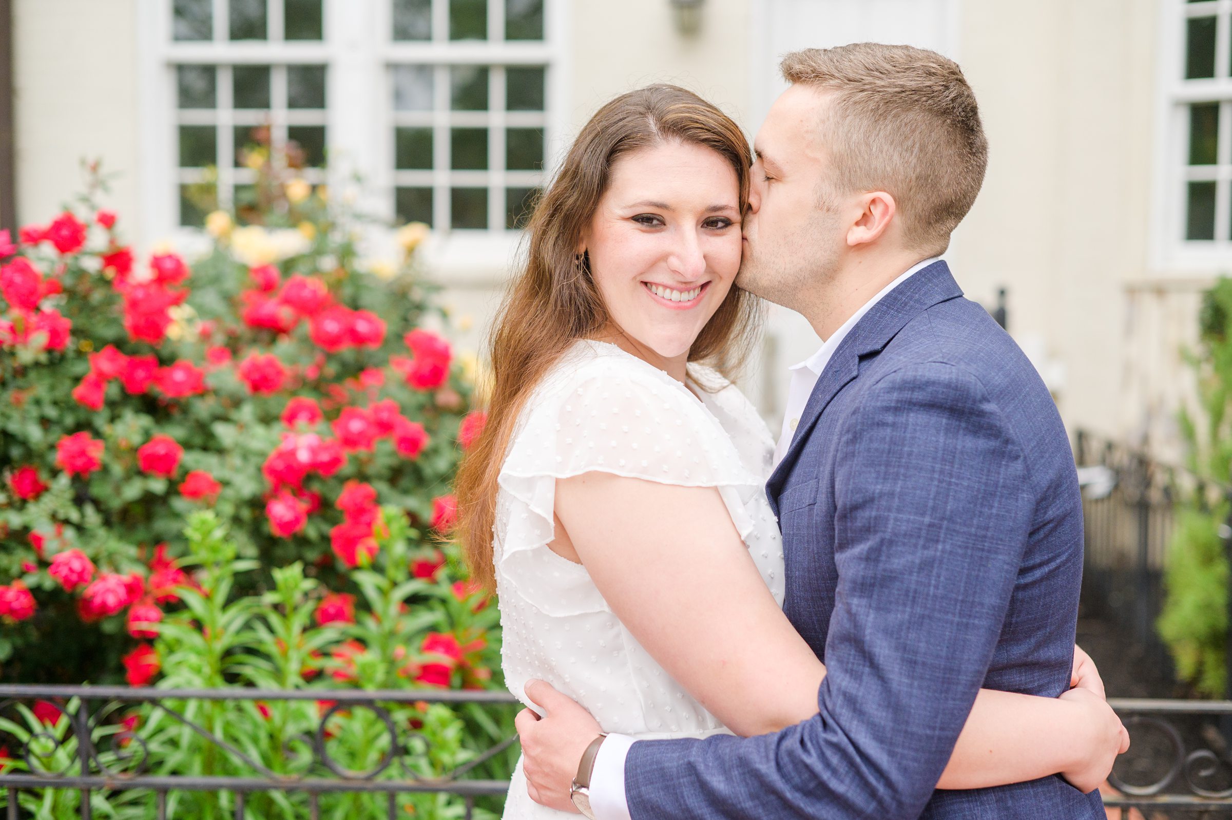 Engaged couple smiles in Foggy Bottom during engagement session at the Kennedy Center photographed by Baltimore Wedding Photographer Cait Kramer Photography