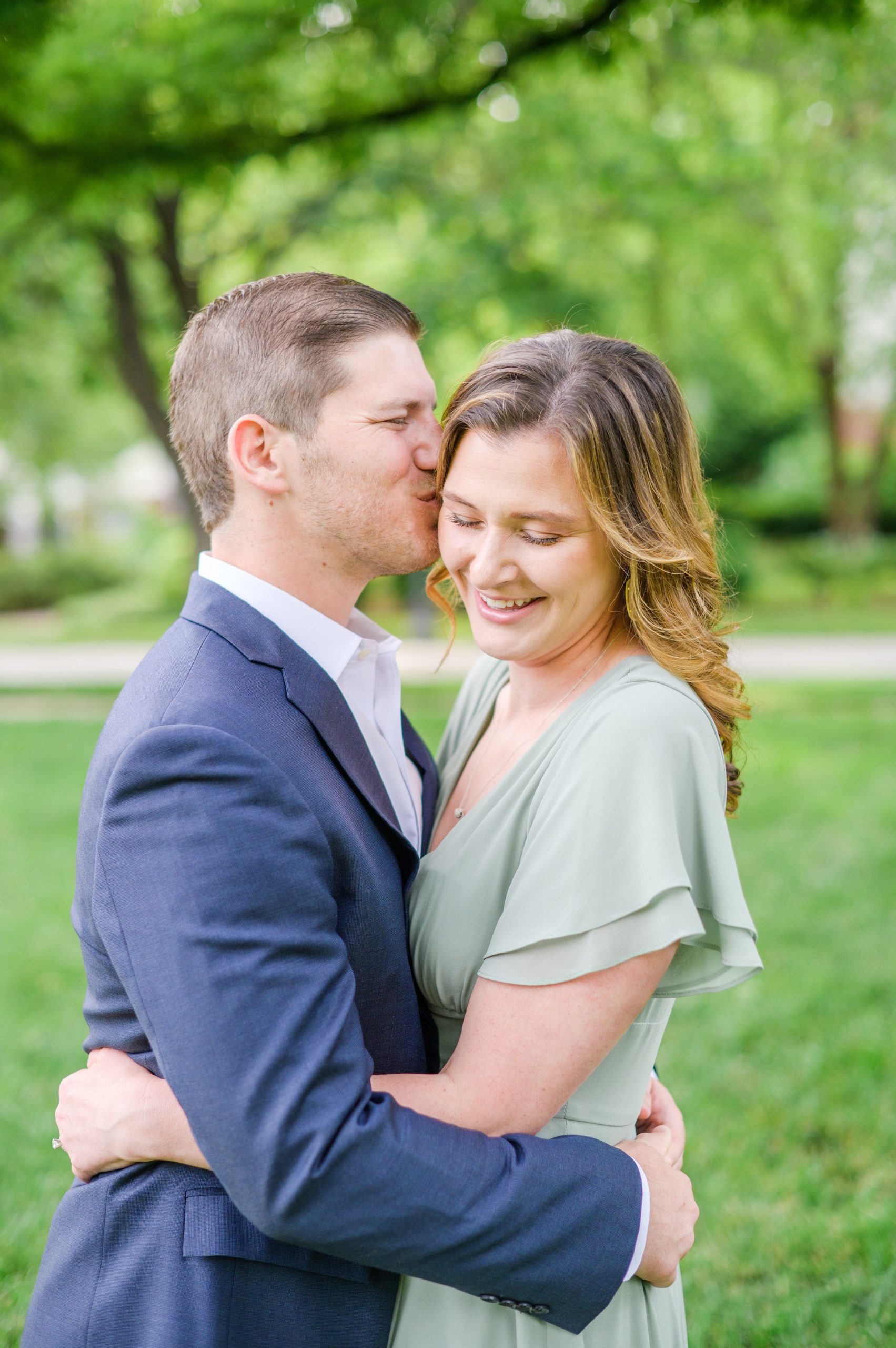 Engaged Couple smiles in Sherwood Gardens engagement session photographed by Maryland Wedding Photographer Cait Kramer Photography