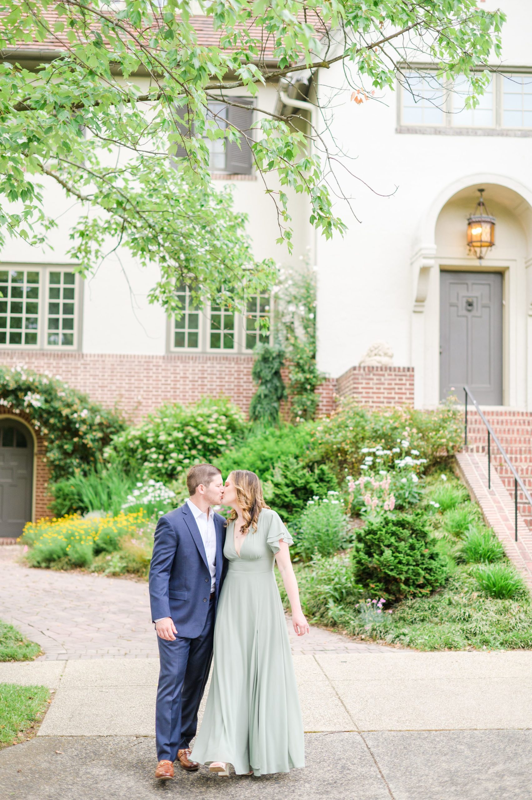 Engaged Couple smiles in Sherwood Gardens engagement session photographed by Maryland Wedding Photographer Cait Kramer Photography