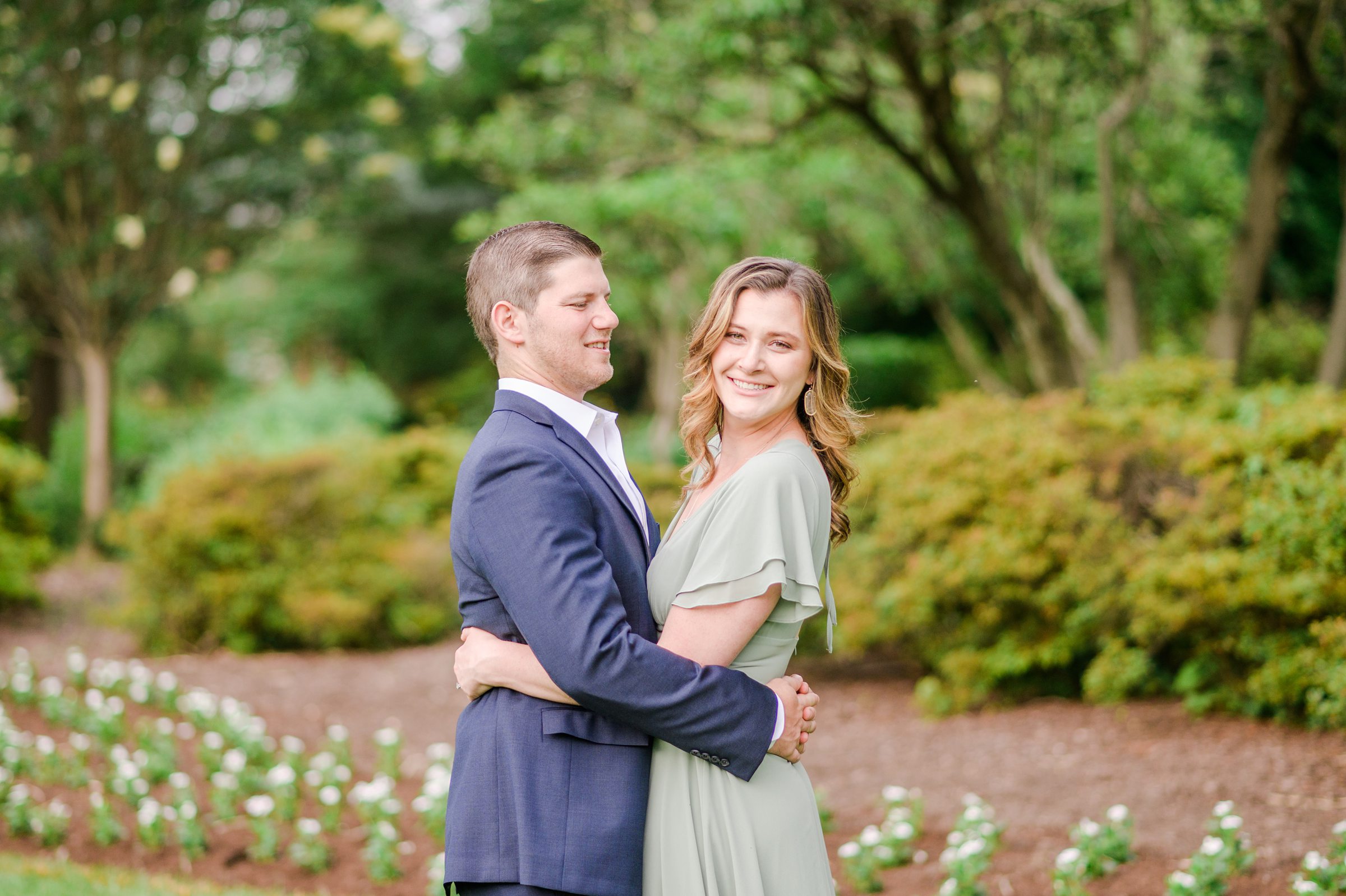 Engaged Couple smiles in Sherwood Gardens engagement session photographed by Maryland Wedding Photographer Cait Kramer Photography