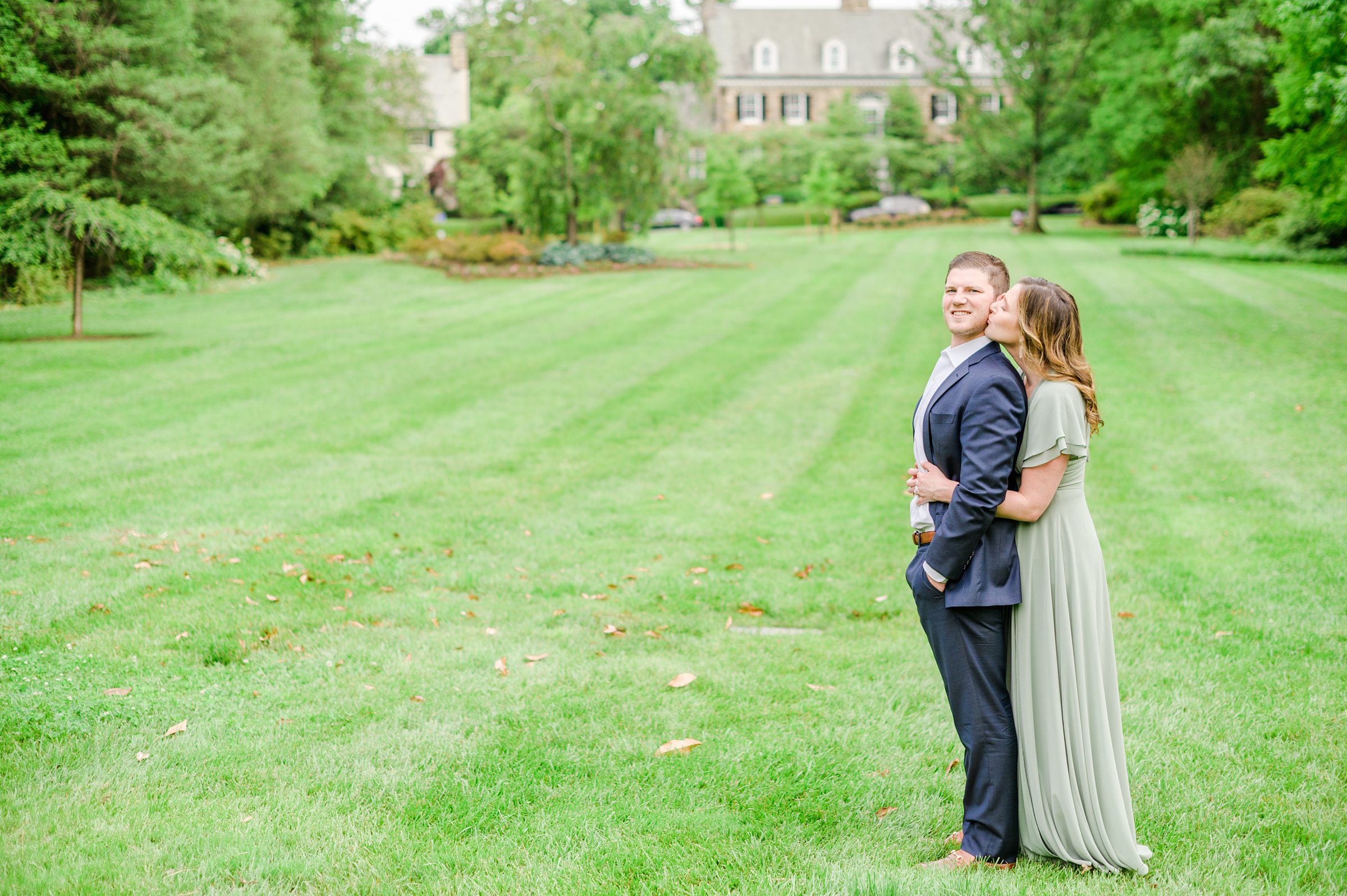 Engaged Couple smiles in Sherwood Gardens engagement session photographed by Maryland Wedding Photographer Cait Kramer Photography