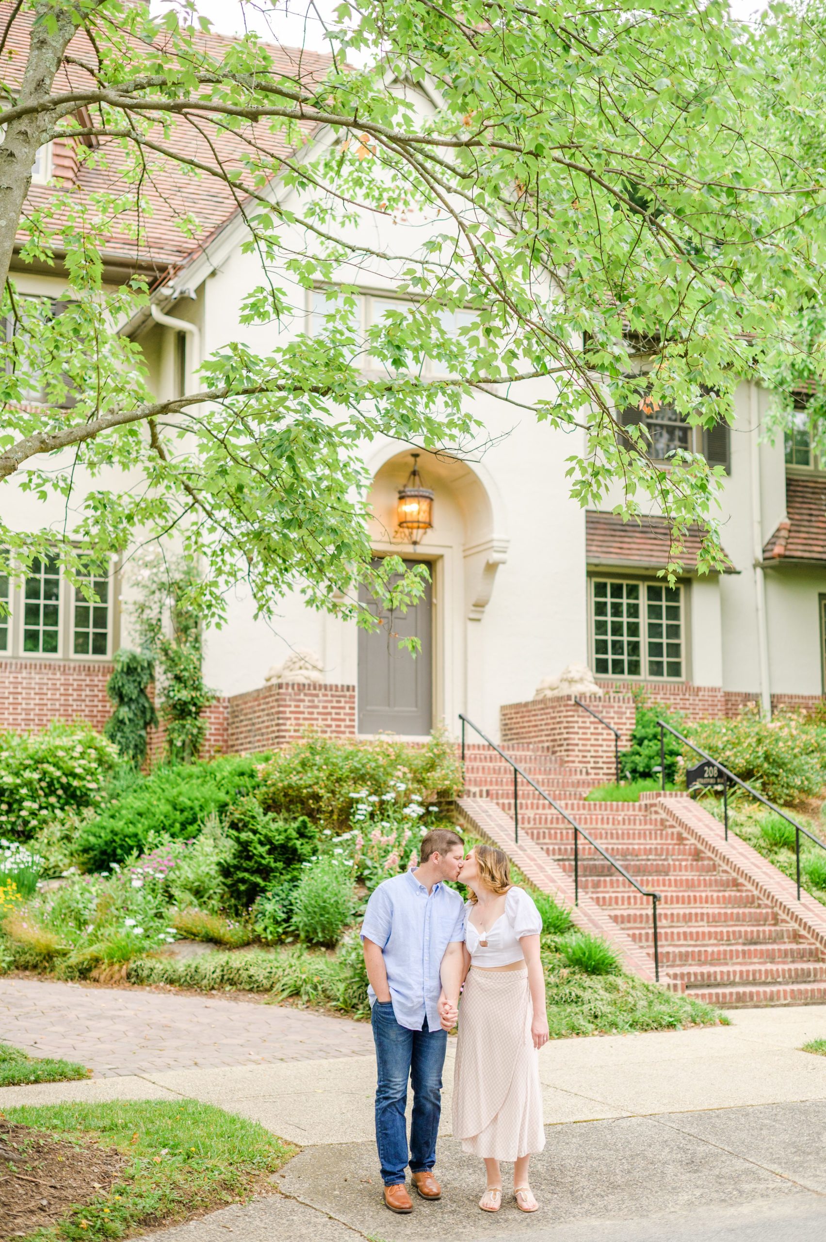 Engaged Couple smiles in Sherwood Gardens engagement session photographed by Maryland Wedding Photographer Cait Kramer Photography