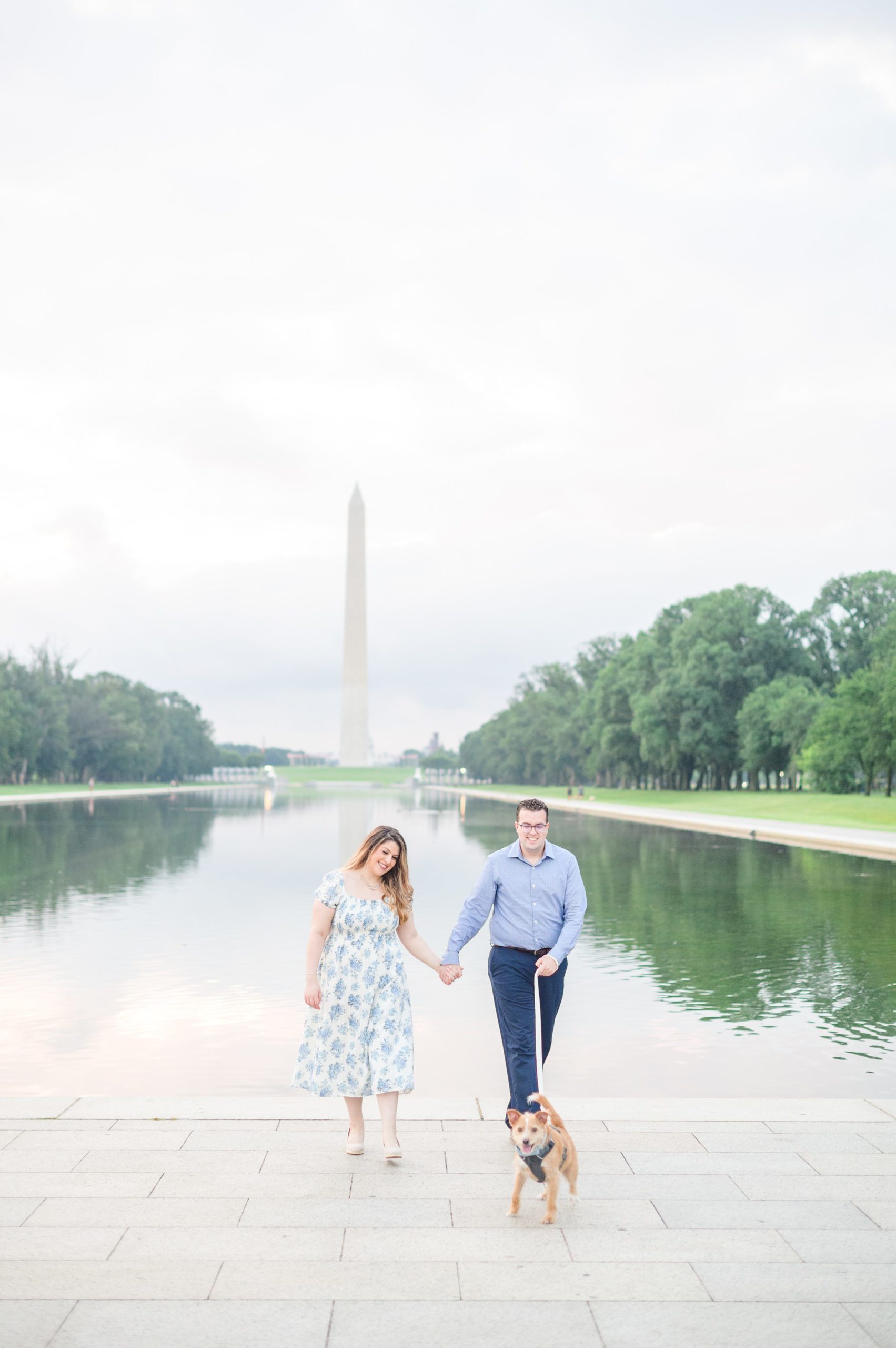 Couple smiles during their engagement photos at the Lincoln Memorial photographed by Baltimore Wedding Photographer, Cait Kramer Photography