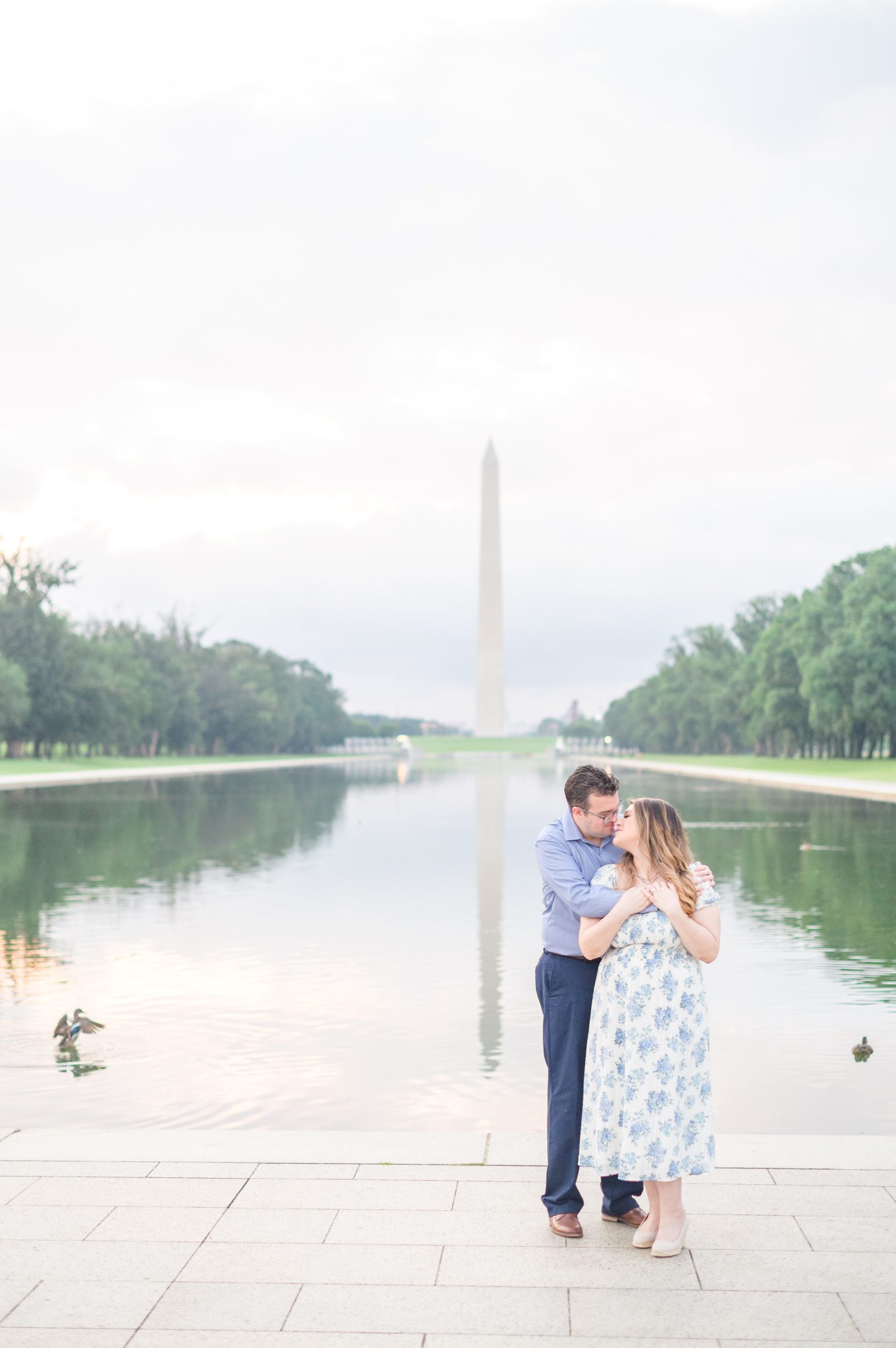 Couple smiles during their engagement photos at the Lincoln Memorial photographed by Baltimore Wedding Photographer, Cait Kramer Photography