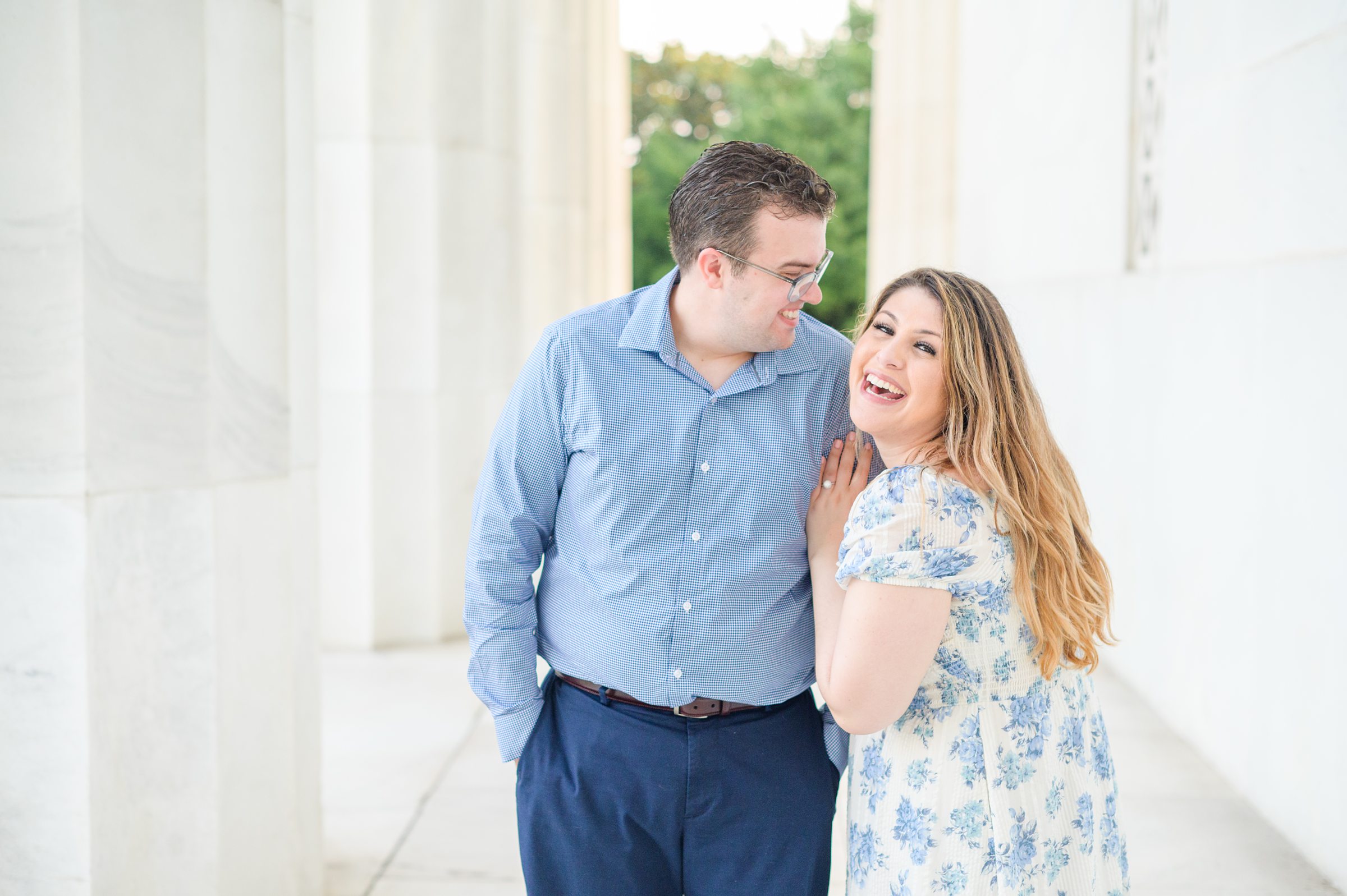 Couple smiles during their engagement photos at the Lincoln Memorial photographed by Baltimore Wedding Photographer, Cait Kramer Photography