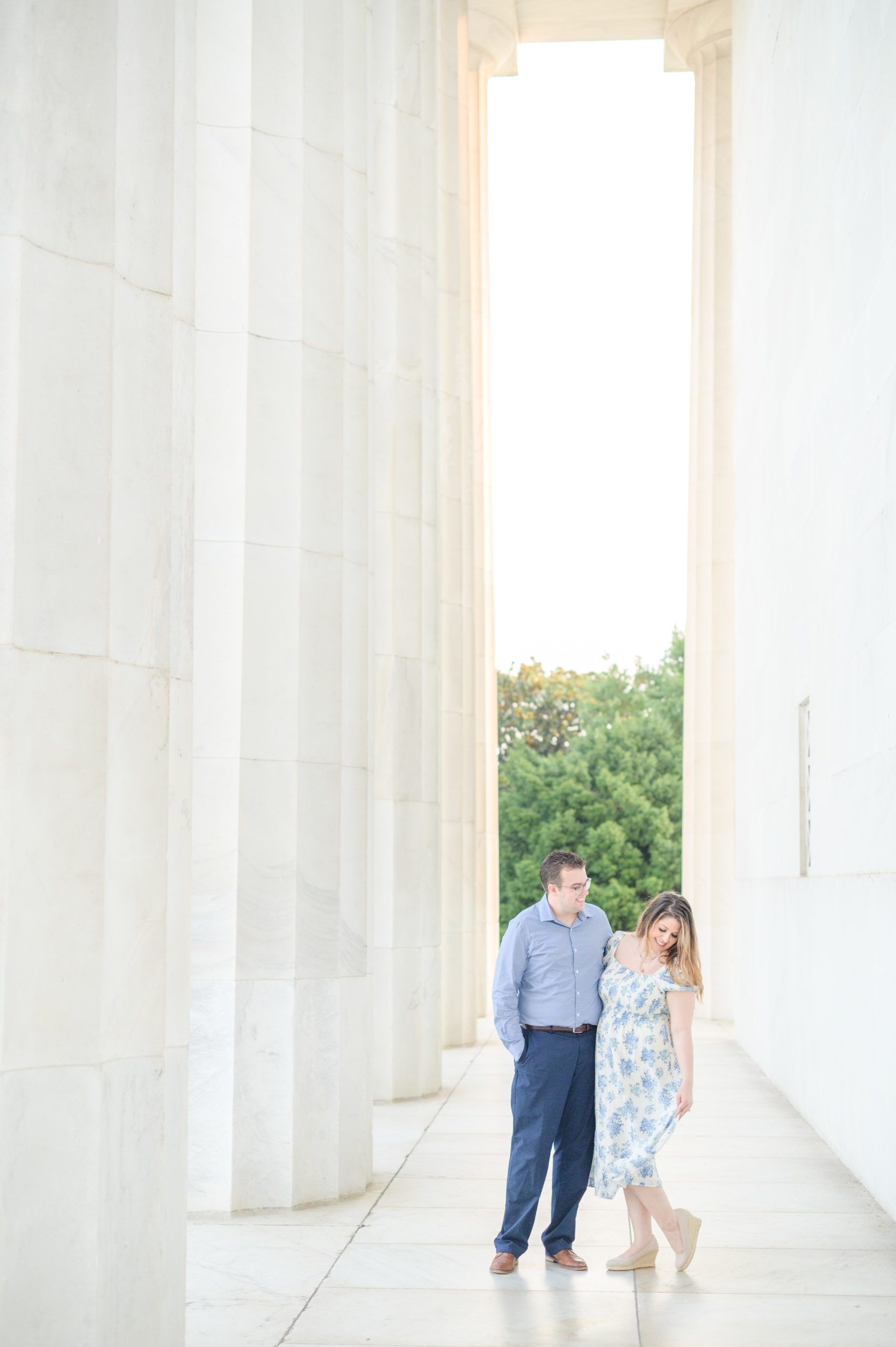 Couple smiles during their engagement photos at the Lincoln Memorial photographed by Baltimore Wedding Photographer, Cait Kramer Photography