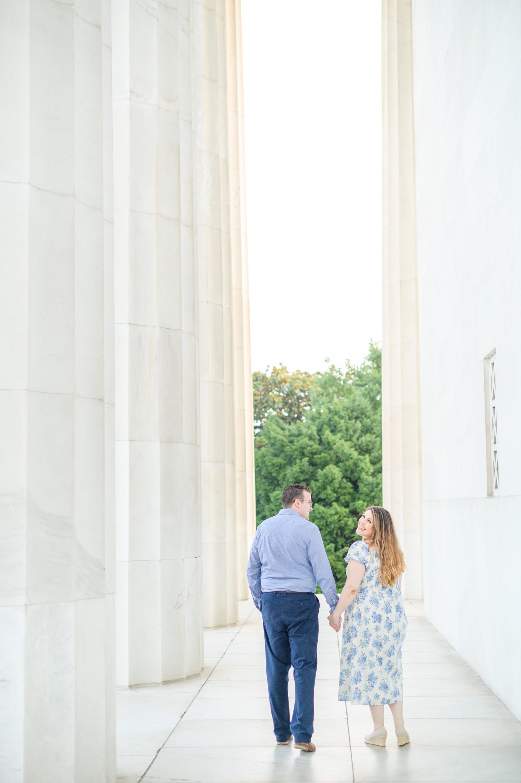 Couple smiles during their engagement photos at the Lincoln Memorial photographed by Baltimore Wedding Photographer, Cait Kramer Photography