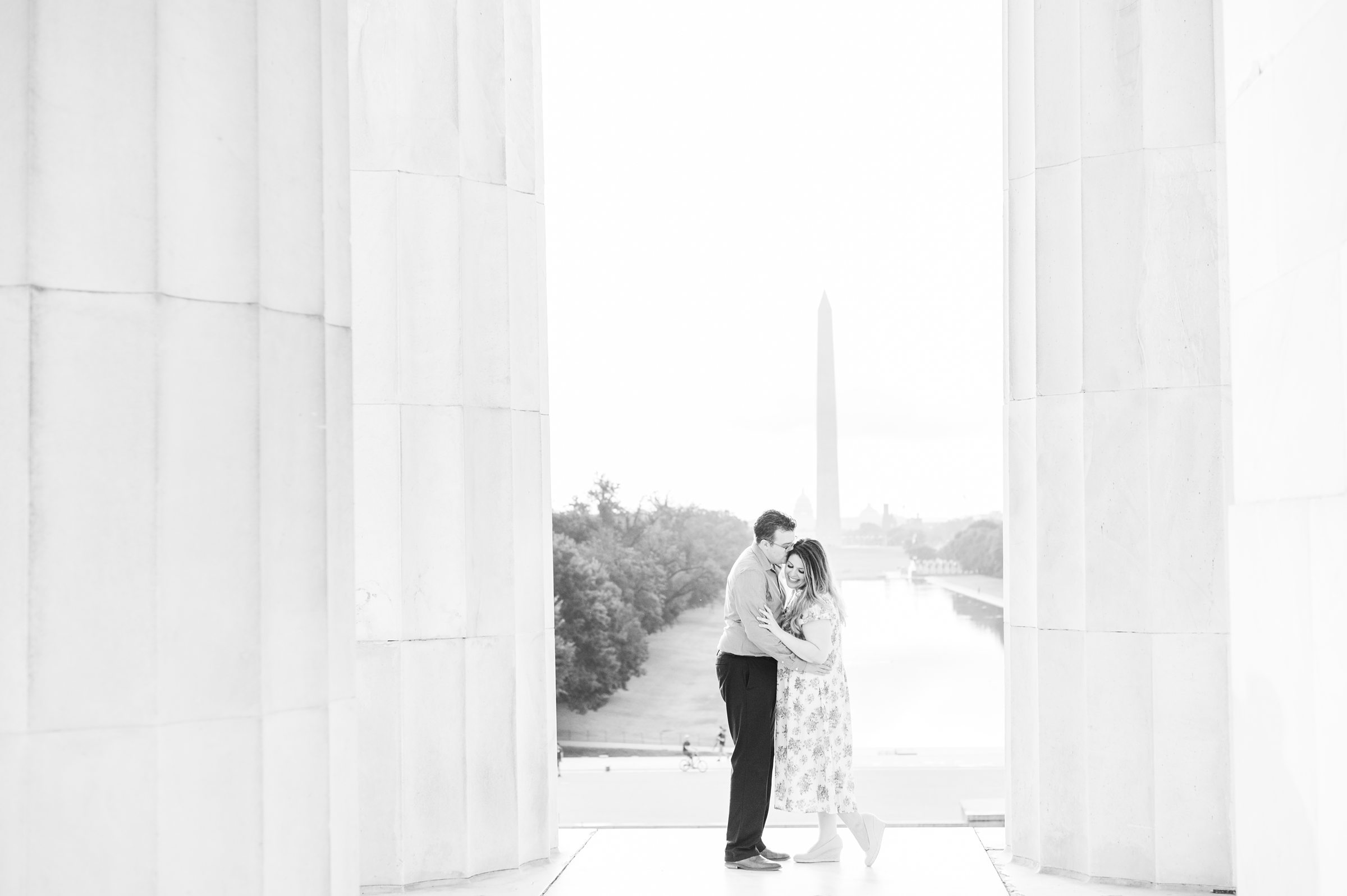 Couple smiles during their engagement photos at the Lincoln Memorial photographed by Baltimore Wedding Photographer, Cait Kramer Photography