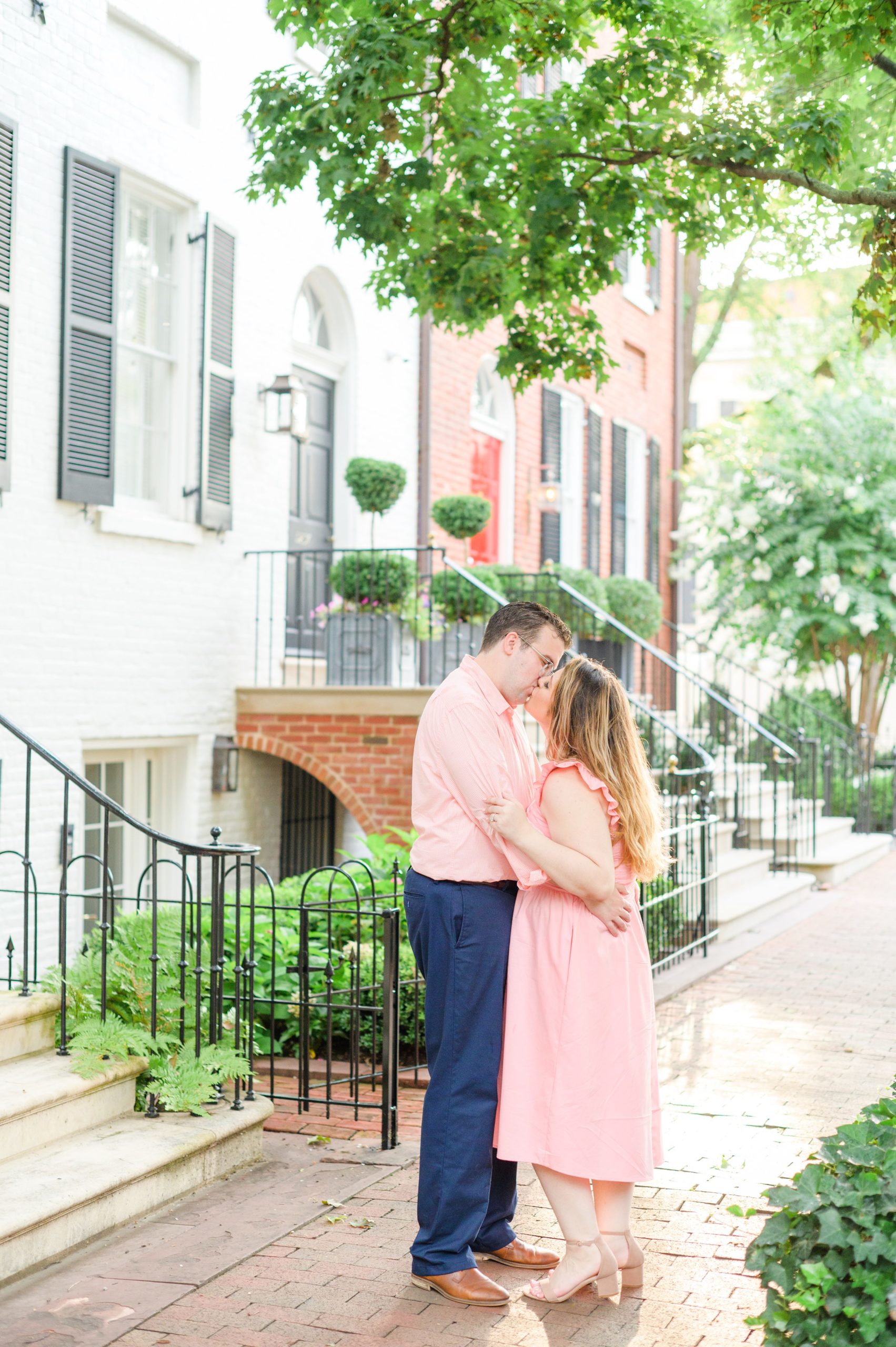 Engaged couple smiles in Georgetown, Washington, DC during engagement session photographed by Baltimore wedding photographer, Cait Kramer Photography