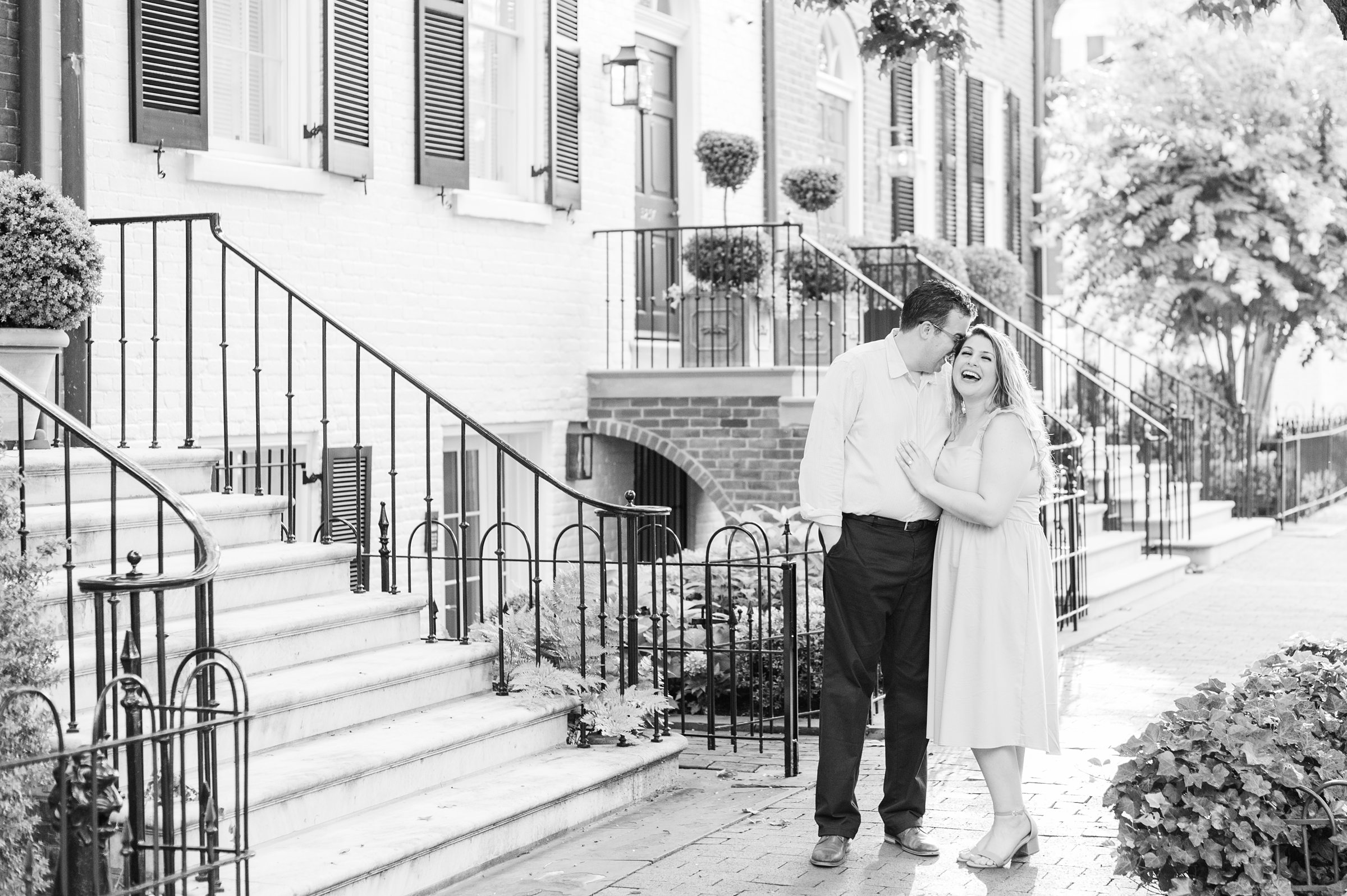Engaged couple smiles in Georgetown, Washington, DC during engagement session photographed by Baltimore wedding photographer, Cait Kramer Photography
