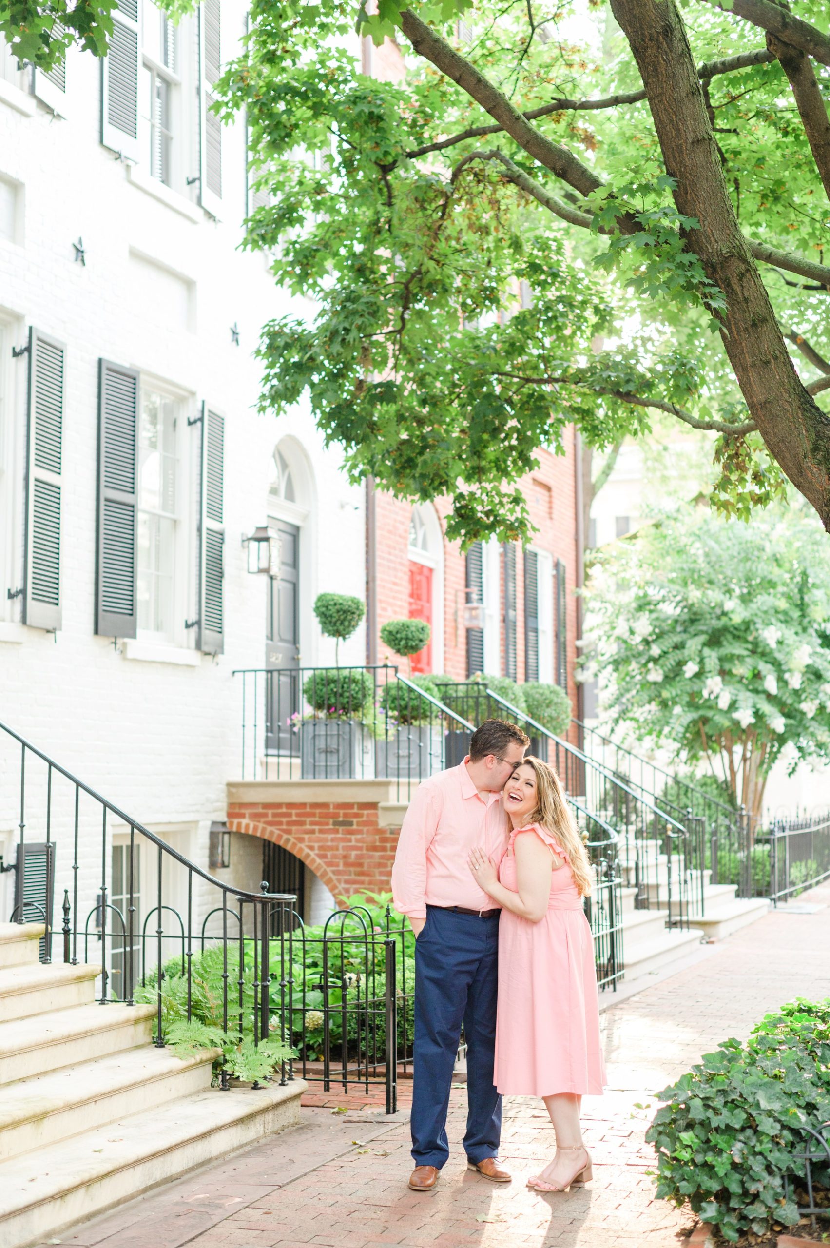 Engaged couple smiles in Georgetown, Washington, DC during engagement session photographed by Baltimore wedding photographer, Cait Kramer Photography