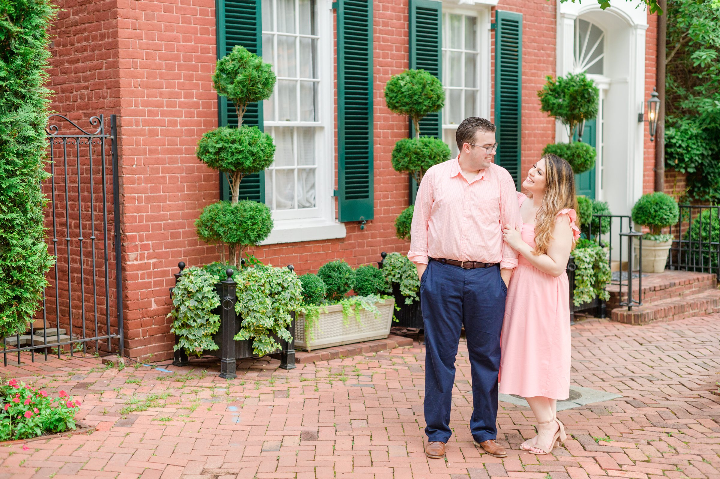 Engaged couple smiles in Georgetown, Washington, DC during engagement session photographed by Baltimore wedding photographer, Cait Kramer Photography