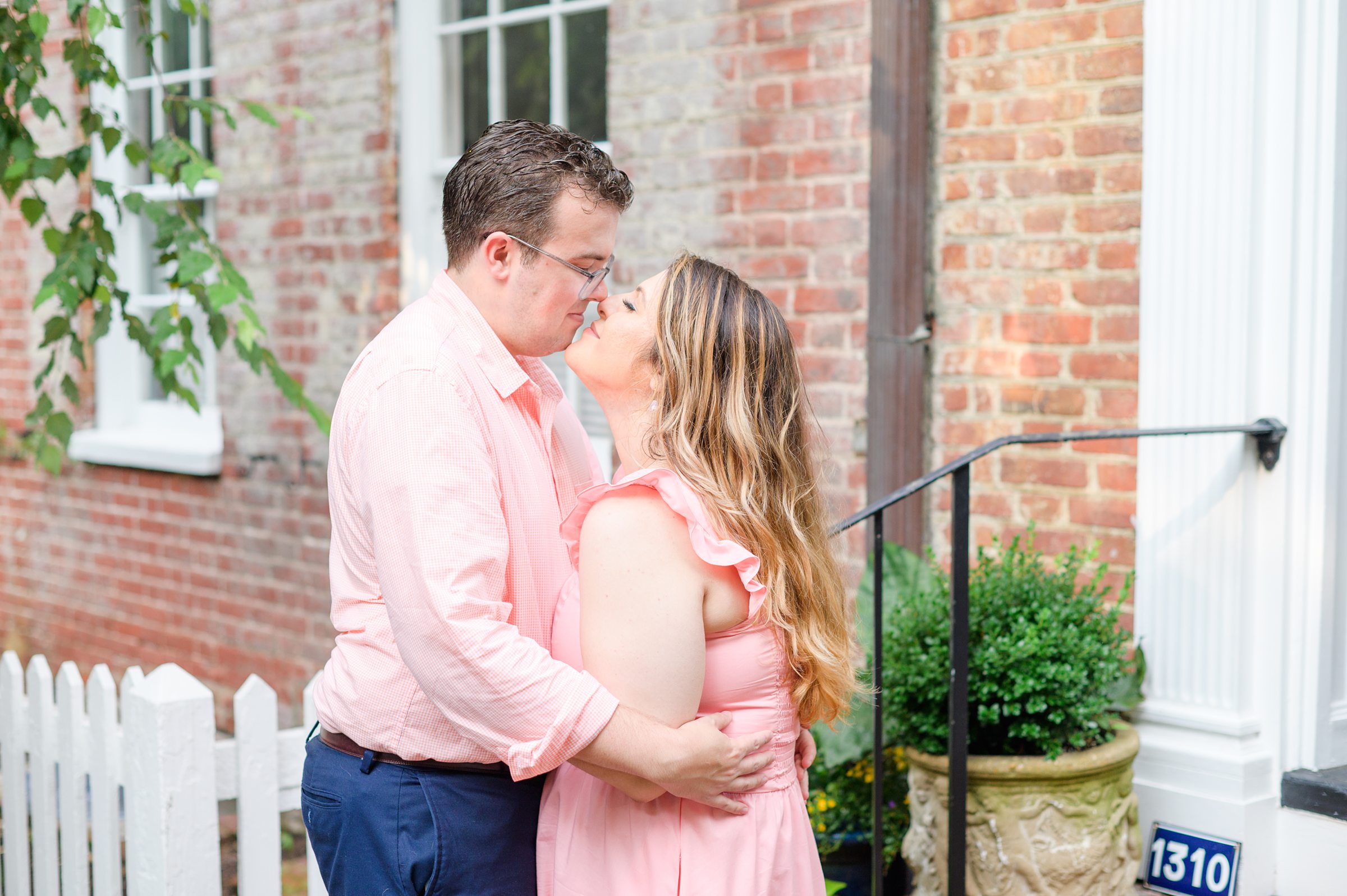 Engaged couple smiles in Georgetown, Washington, DC during engagement session photographed by Baltimore wedding photographer, Cait Kramer Photography