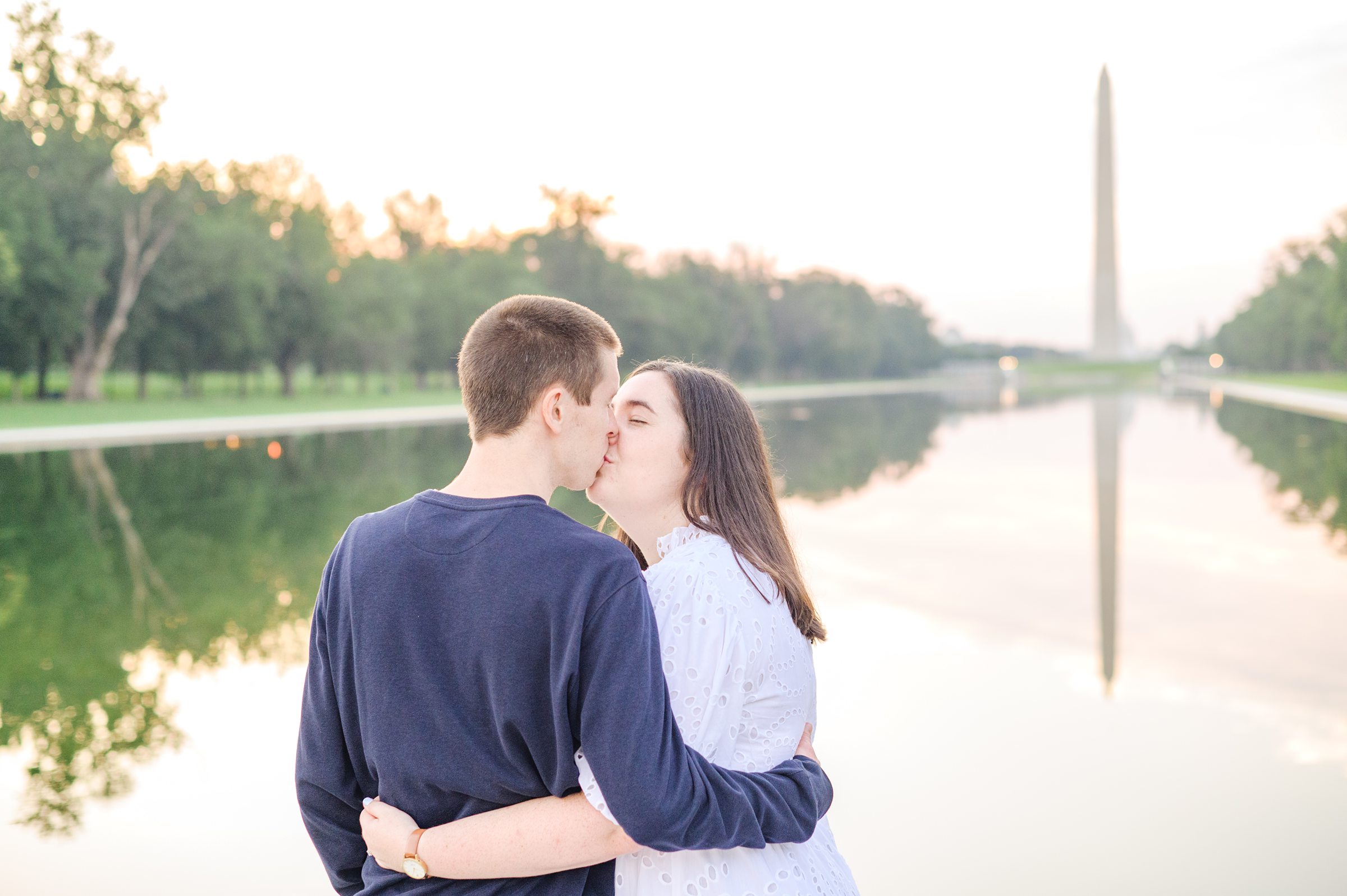 Couple smiles during their Lincoln Memorial engagement photos during session photographed by Baltimore wedding photographer, Cait Kramer