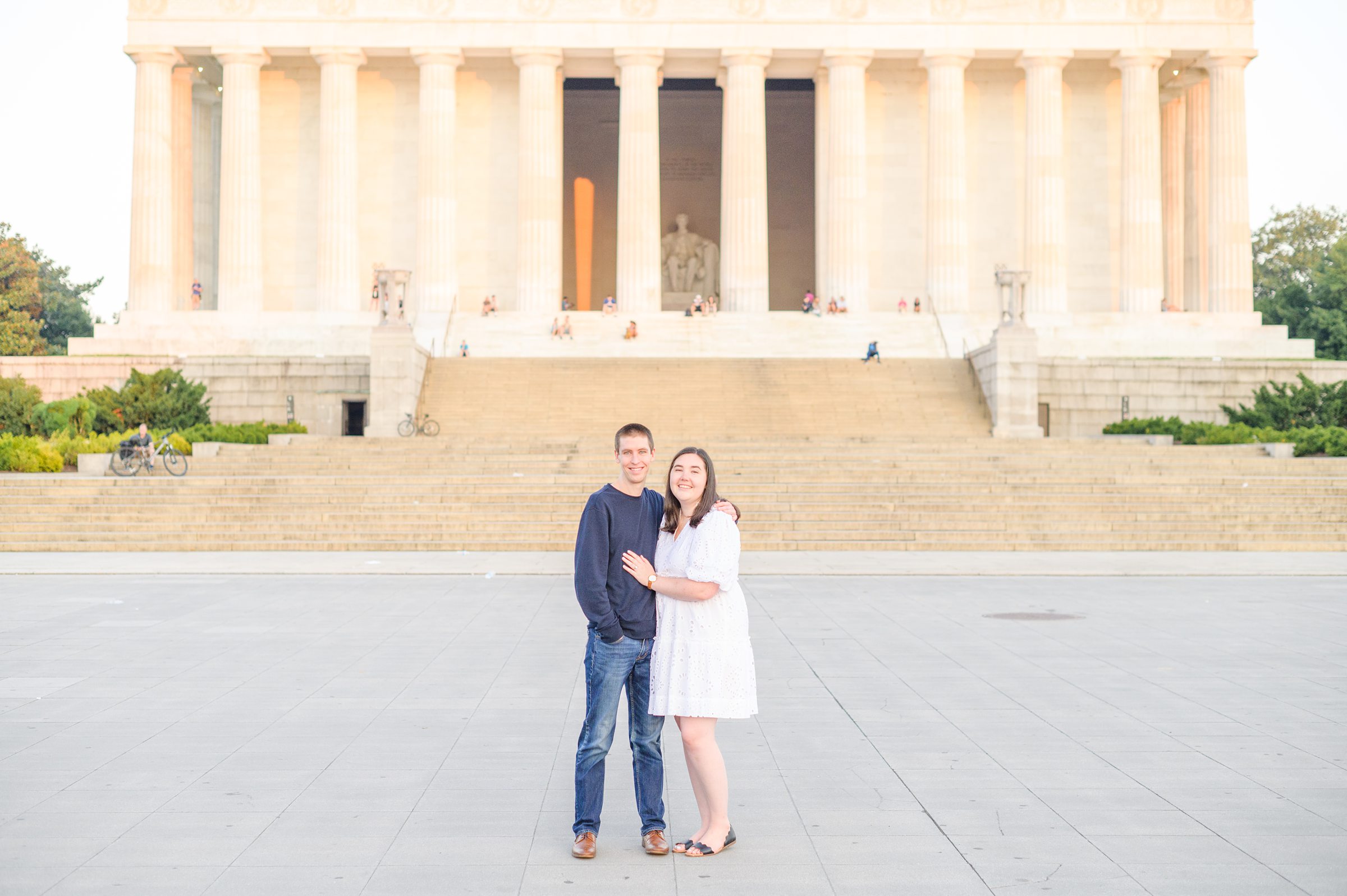 Couple smiles during their Lincoln Memorial engagement photos during session photographed by Baltimore wedding photographer, Cait Kramer