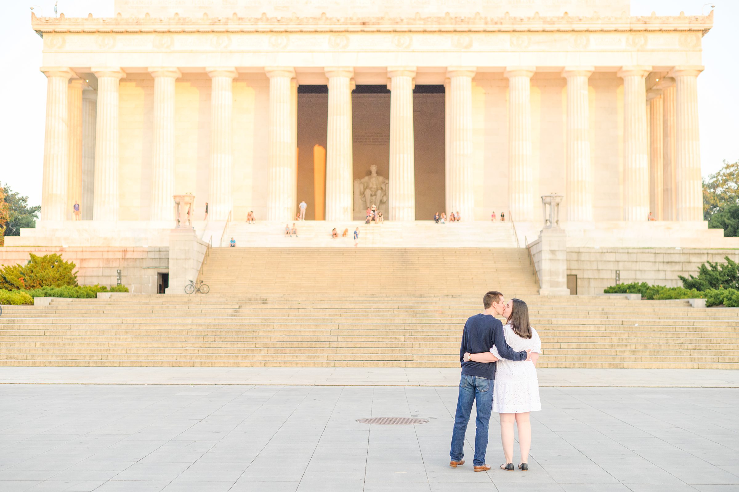 Couple smiles during their Lincoln Memorial engagement photos during session photographed by Baltimore wedding photographer, Cait Kramer