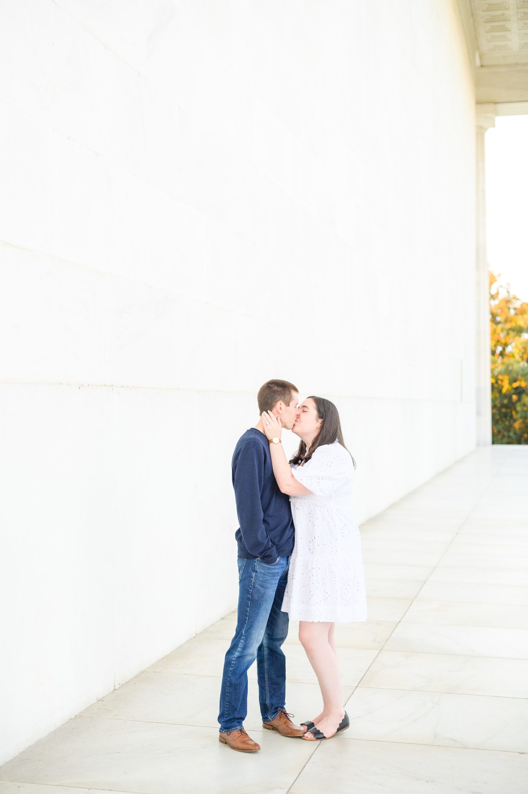 Couple smiles during their Lincoln Memorial engagement photos during session photographed by Baltimore wedding photographer, Cait Kramer