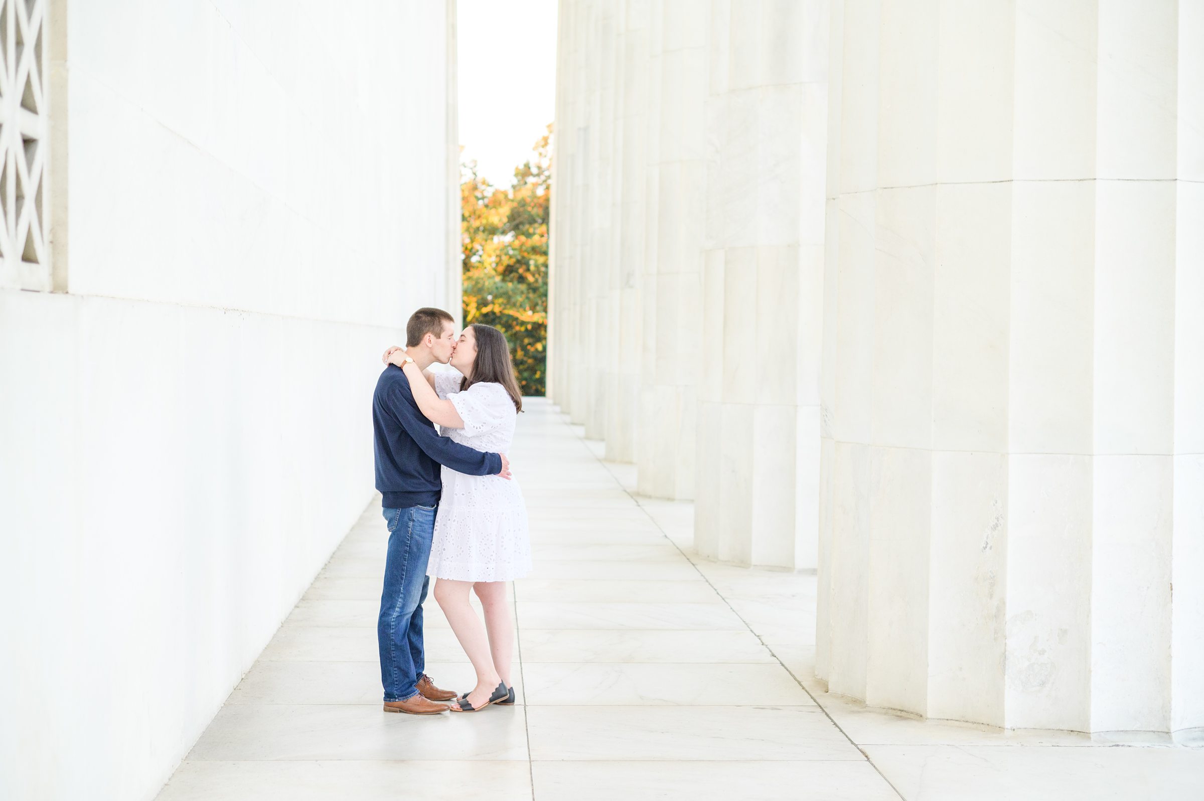 Couple smiles during their Lincoln Memorial engagement photos during session photographed by Baltimore wedding photographer, Cait Kramer