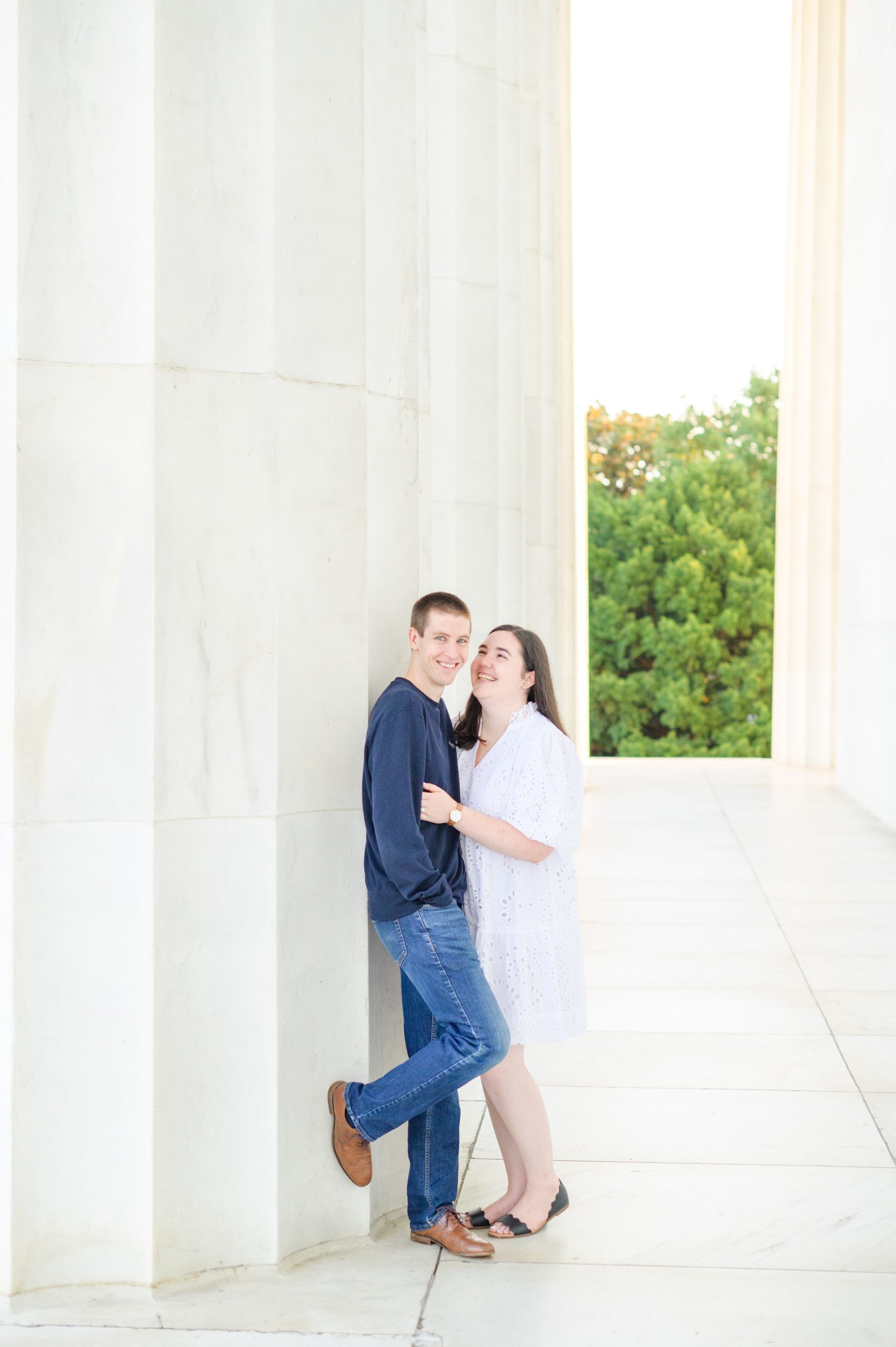 Couple smiles during their Lincoln Memorial engagement photos during session photographed by Baltimore wedding photographer, Cait Kramer