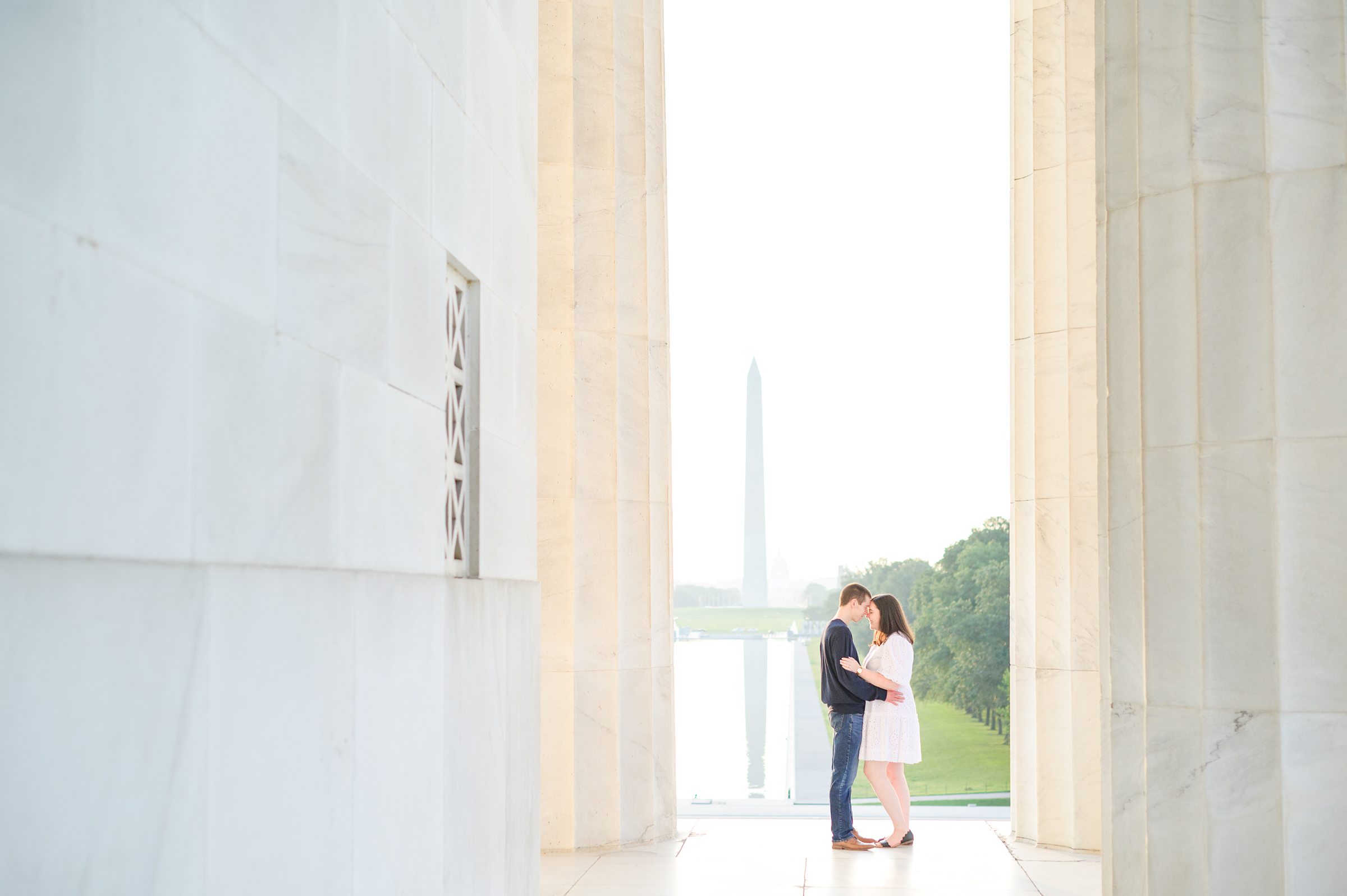 Couple smiles during their Lincoln Memorial engagement photos during session photographed by Baltimore wedding photographer, Cait Kramer