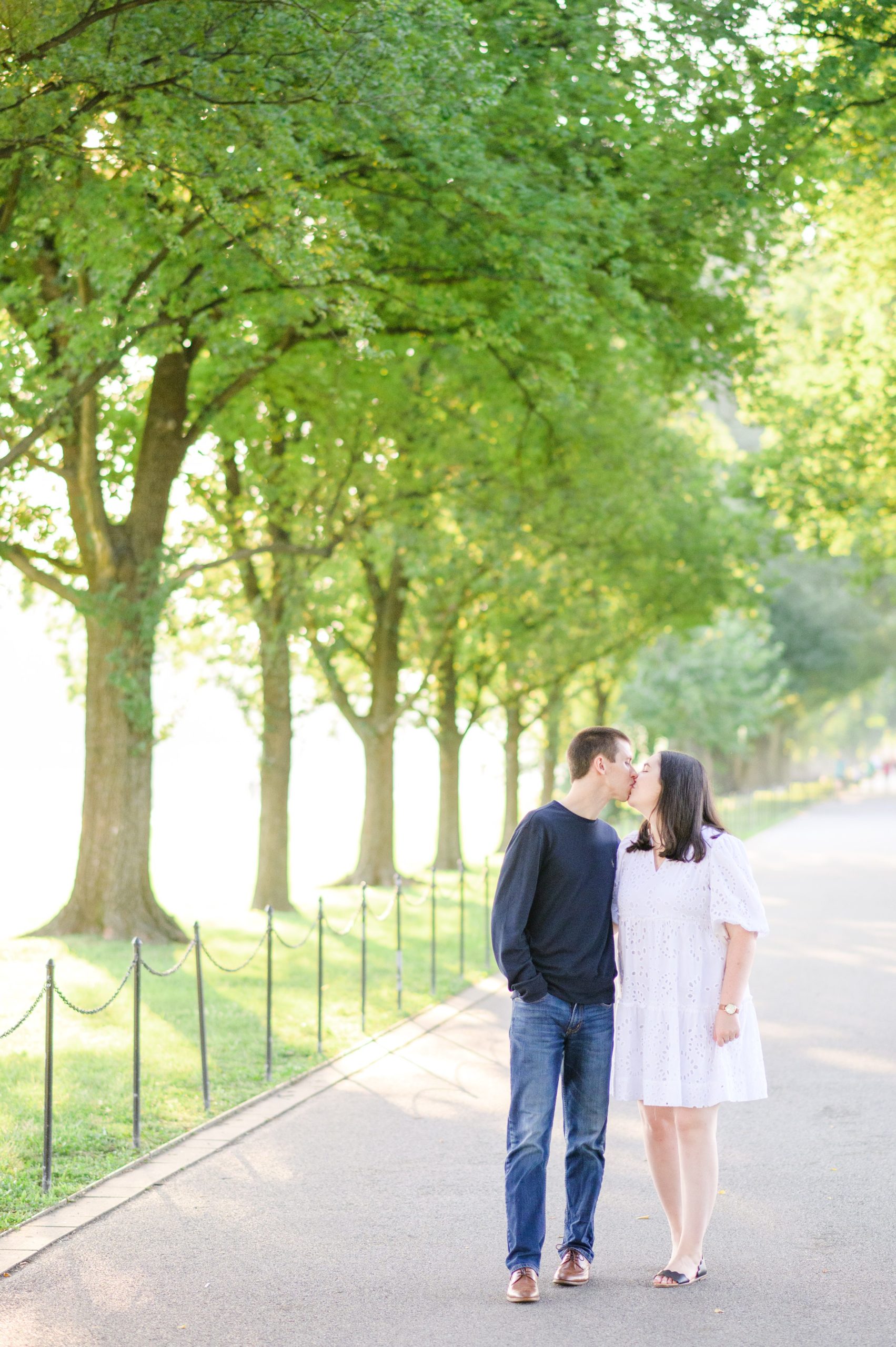 Couple smiles during their Lincoln Memorial engagement photos during session photographed by Baltimore wedding photographer, Cait Kramer