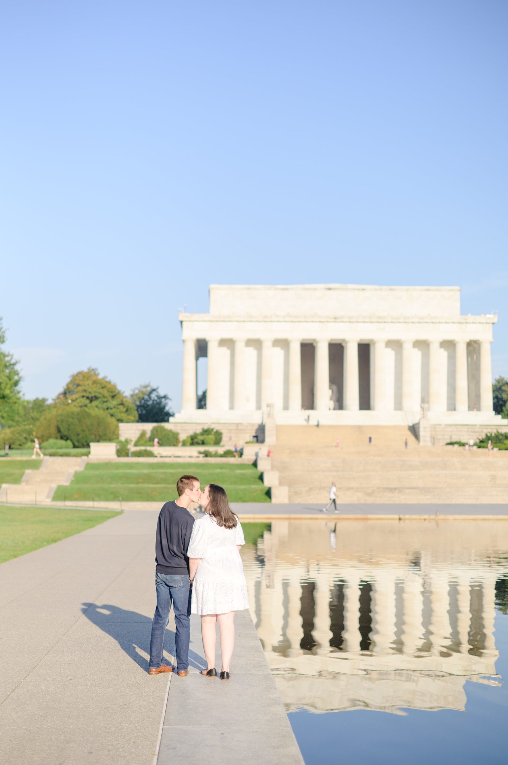 Couple smiles during their Lincoln Memorial engagement photos during session photographed by Baltimore wedding photographer, Cait Kramer