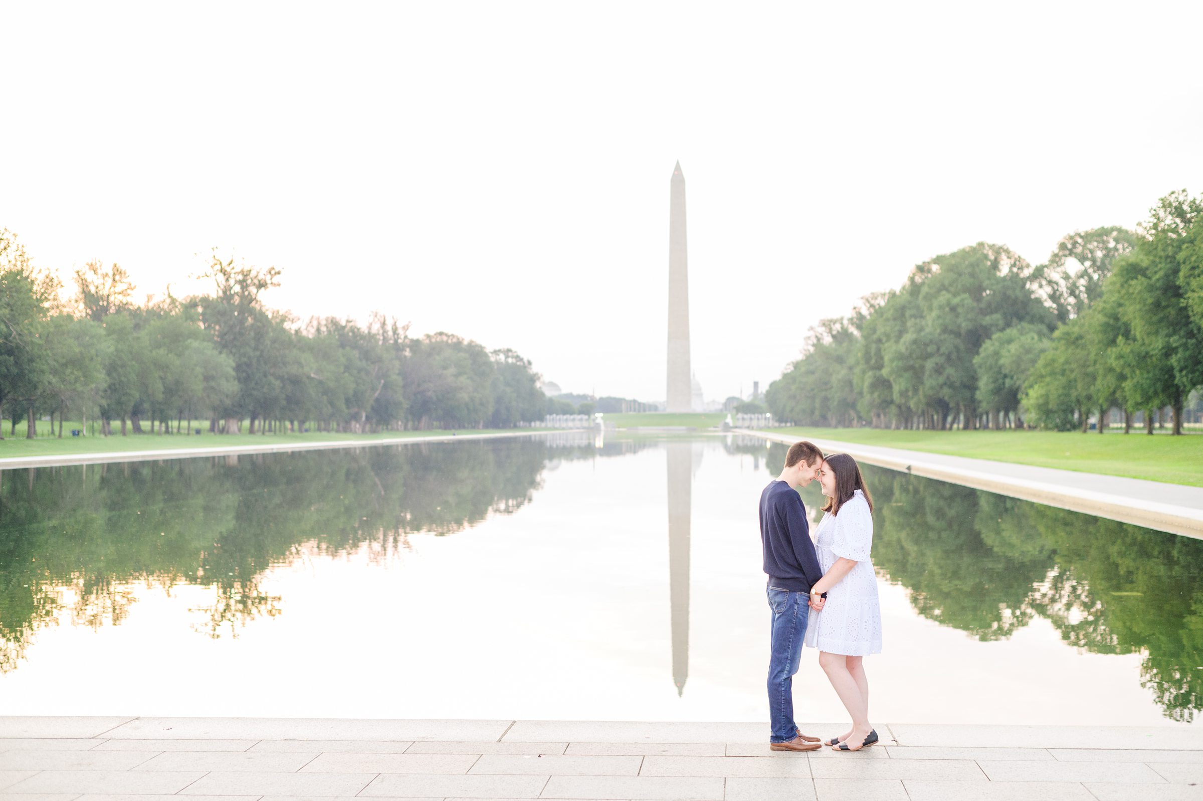 Couple smiles during their Lincoln Memorial engagement photos during session photographed by Baltimore wedding photographer, Cait Kramer