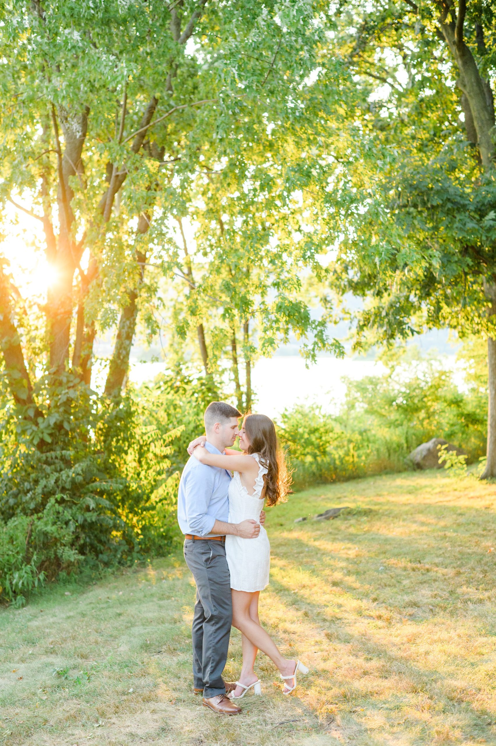 Engaged couple at a local park for their summer engagement session at Fort Hunter Mansion and Park in Harrisburg, Pennsylvania photographed by Baltimore Wedding Photographer Cait Kramer Photography