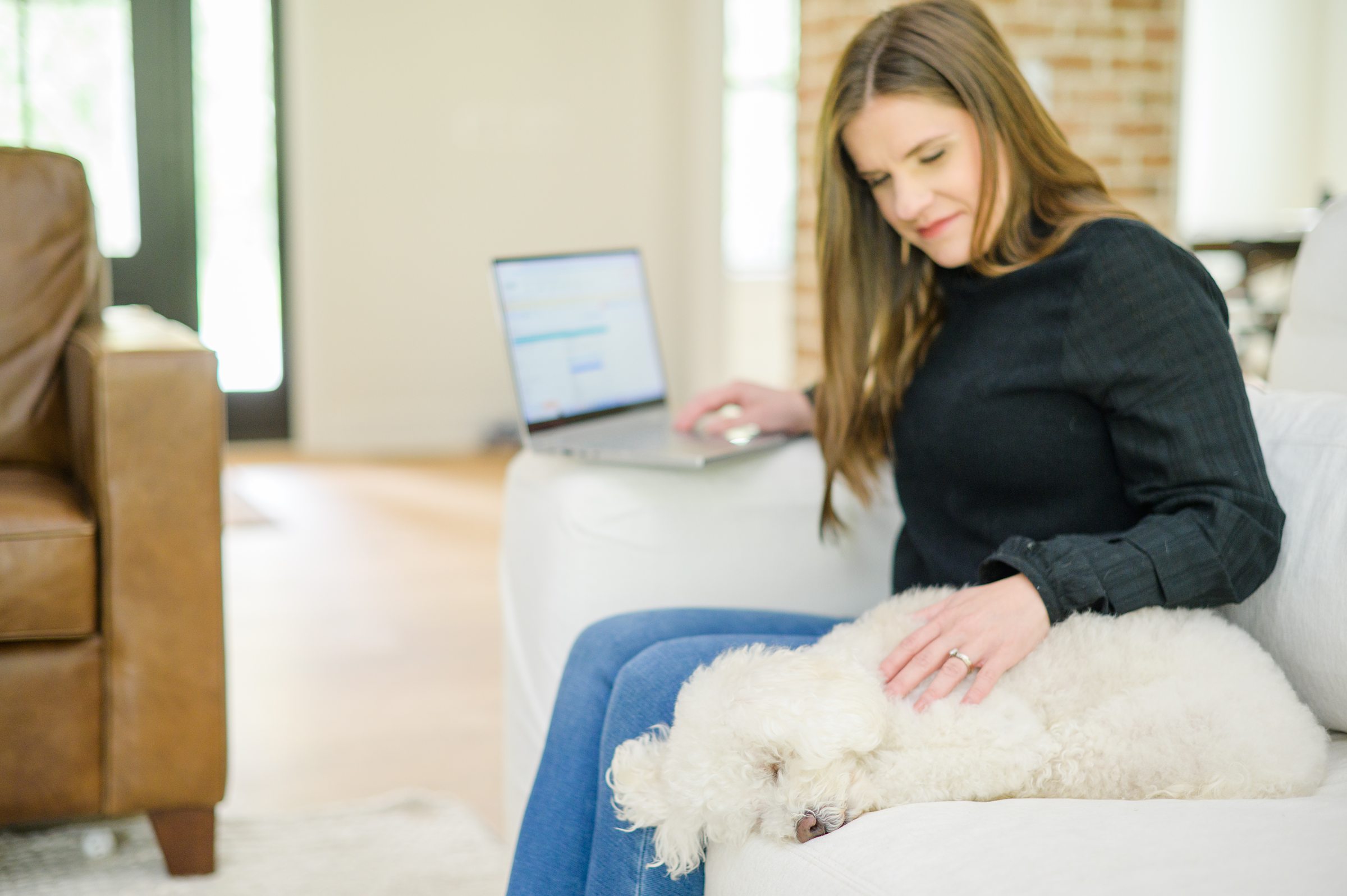 Stacey Caito, Chantilly Realtor, works with her dog at her side during her brand session photographed by Virginia brand photographer, Cait Kramer Photography