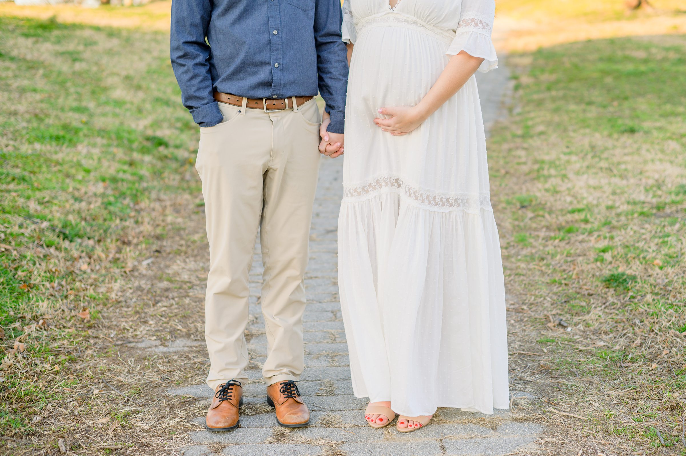 Abby and Nick's maternity session in Patterson Park in Baltimore County featuring a stunning golden hour and beautiful pink trees.