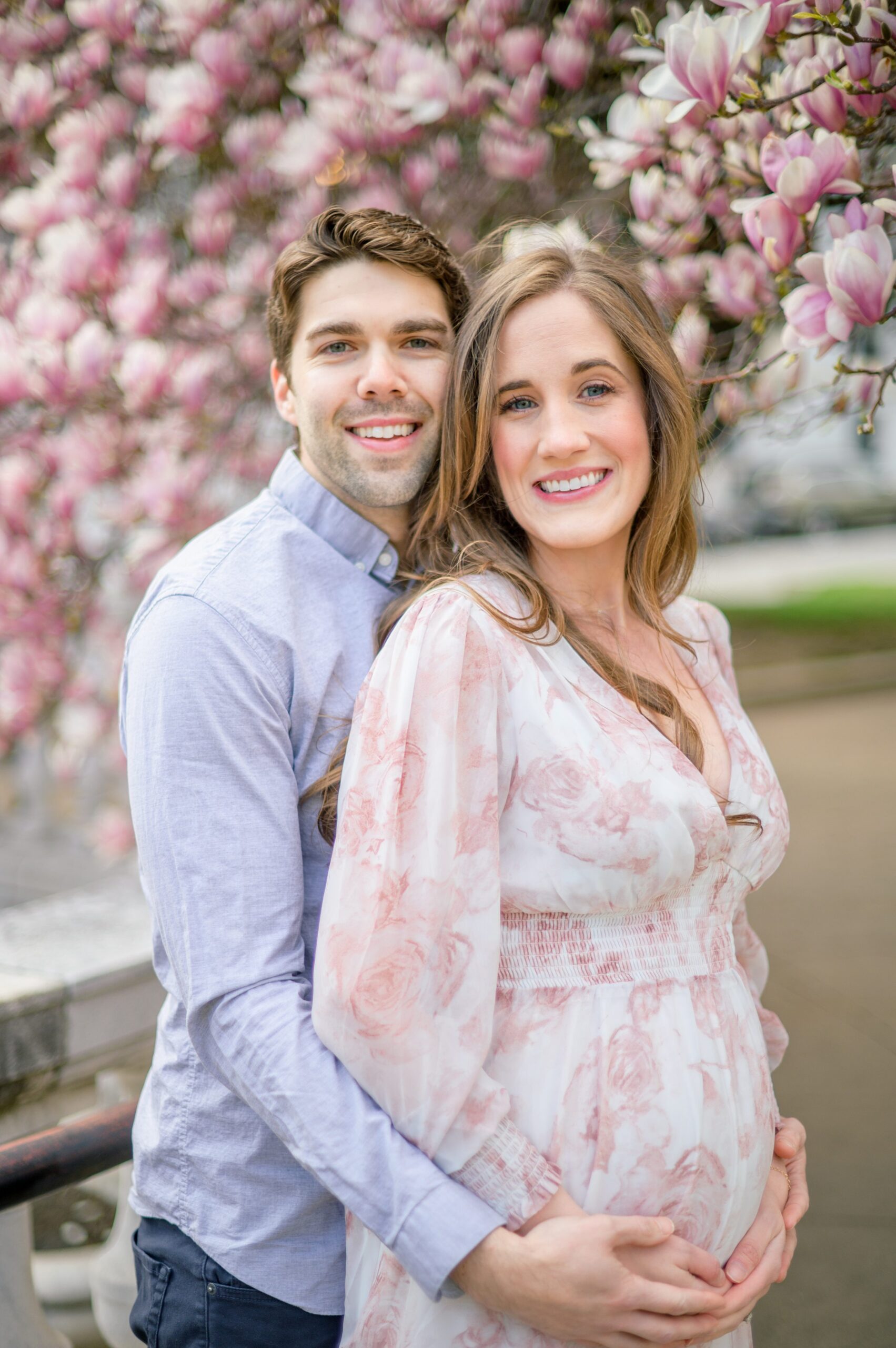 Meg and Sean's maternity photos in Baltimore featuring stunning pink magnolia trees by Baltimore Photographer Cait Kramer Photography