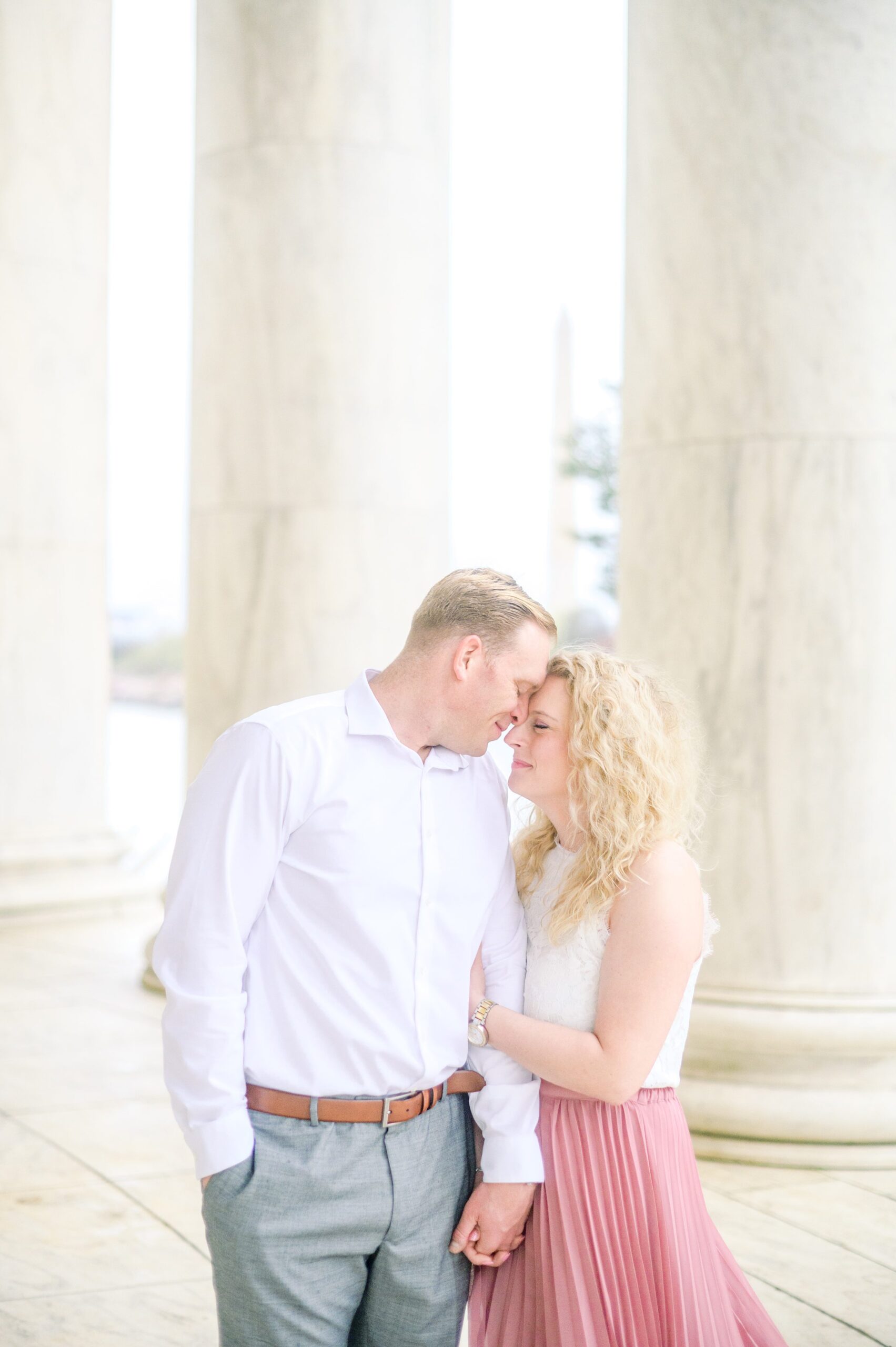 Anniversary portrait session at the Jefferson Memorial featuring the Washington DC Cherry Blossoms. Photographed by Baltimore Photographer Cait Kramer Photography