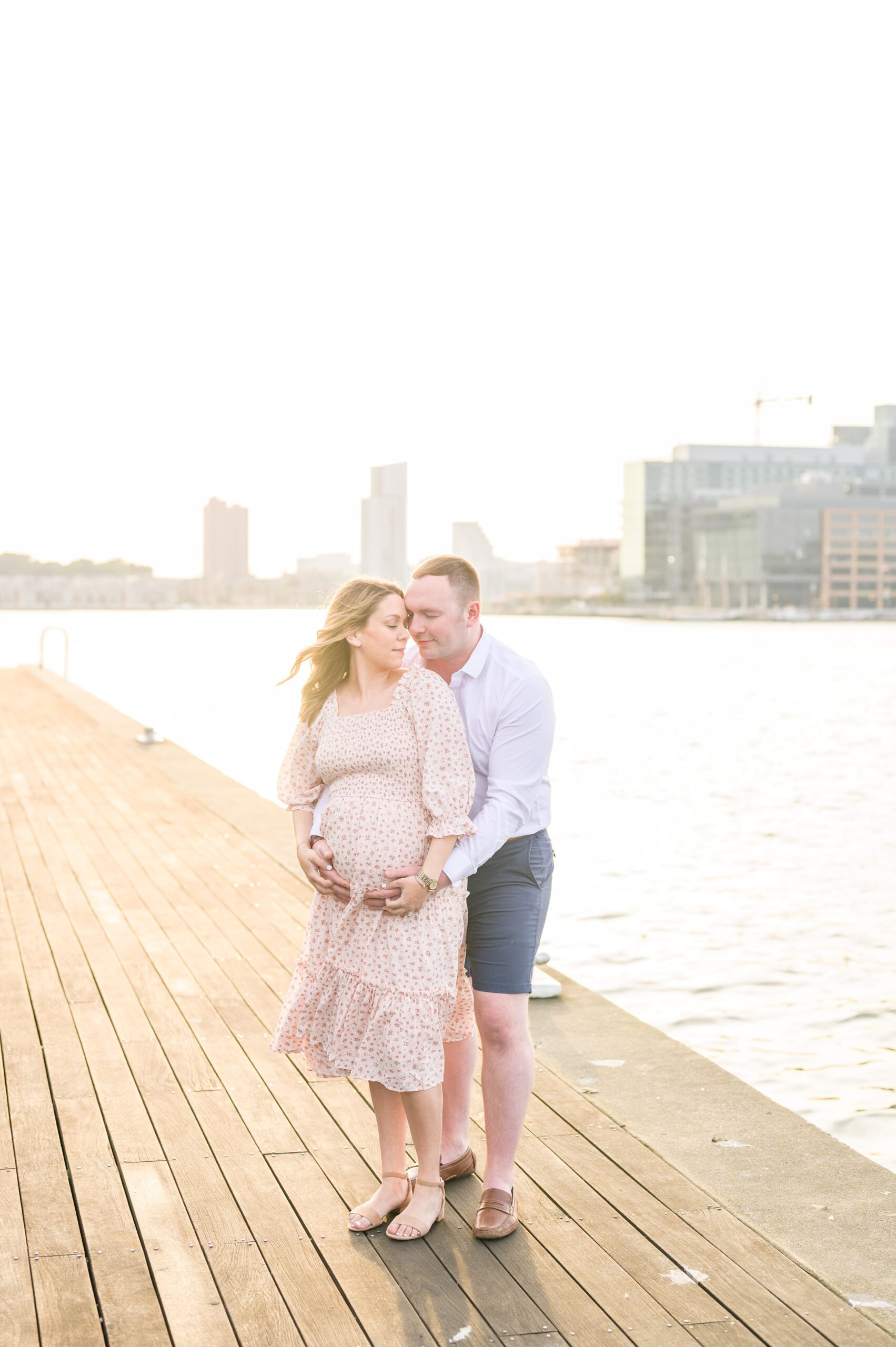 Mary and Adam's maternity photos in Locust Point in Baltimore featuring a stunning golden hour by Baltimore Photographer Cait Kramer Photography