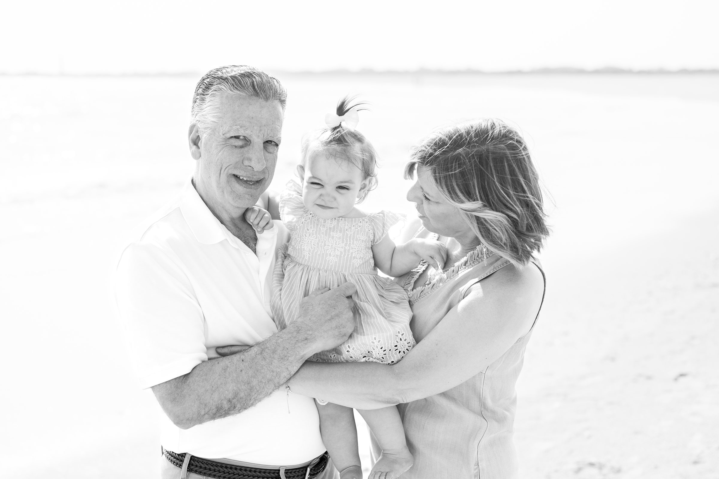 Extended family portraits at Cape May's Cove beach in Maryland, photographed by Cape May Family Photographer Cait Kramer.