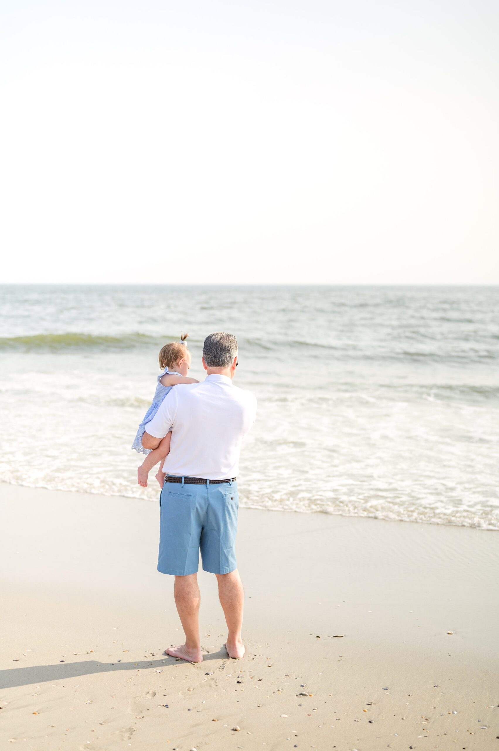 Extended family portraits at Cape May's Cove beach in Maryland, photographed by Cape May Family Photographer Cait Kramer.