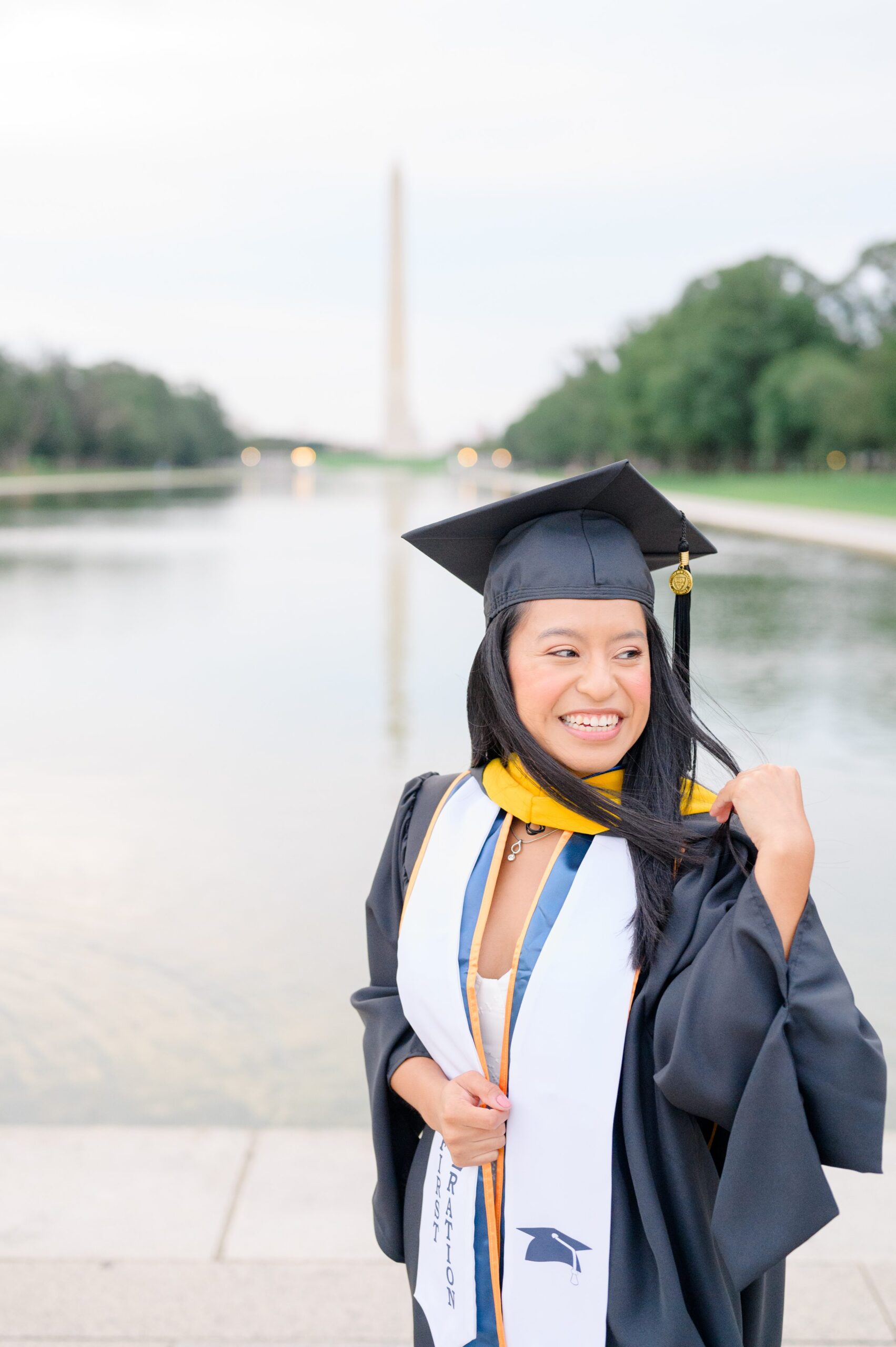 College graduation portrait session at the DC War Memorial in Washington, D.C. photographed by Baltimore Grad Photographer Cait Kramer.