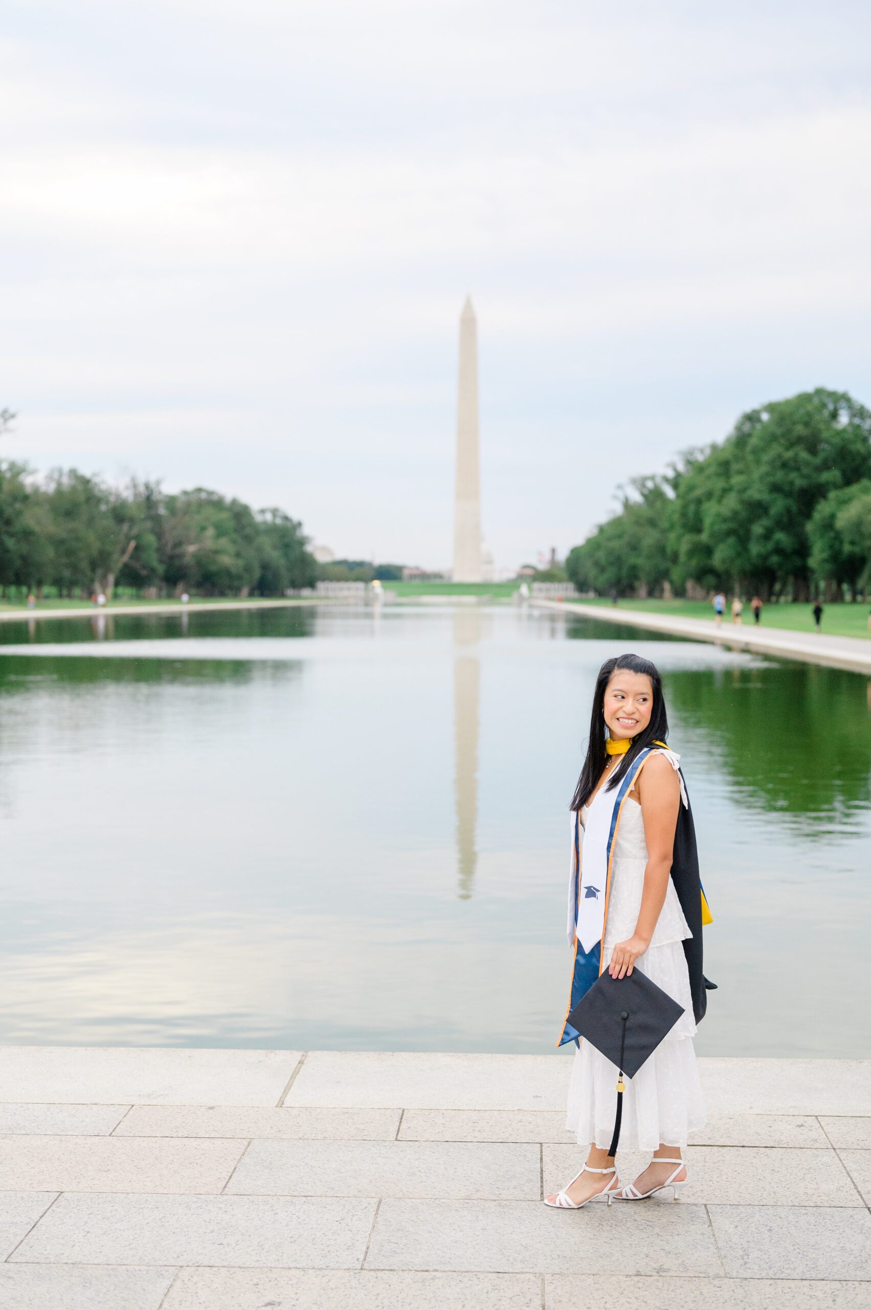 College graduation portrait session at the DC War Memorial in Washington, D.C. photographed by Baltimore Grad Photographer Cait Kramer.