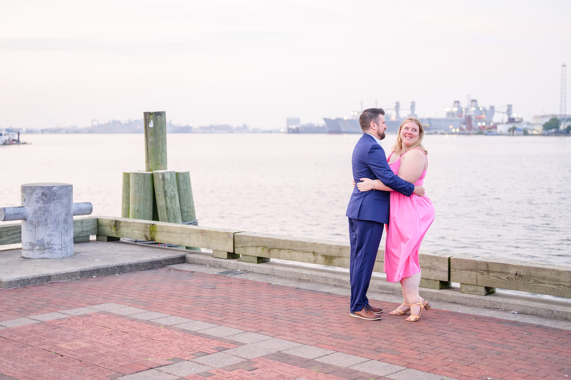 Engaged couple at Fells Point Waterfront for their sunrise engagement session in Baltimore, Maryland photographed by Baltimore Wedding Photographer Cait Kramer Photography.