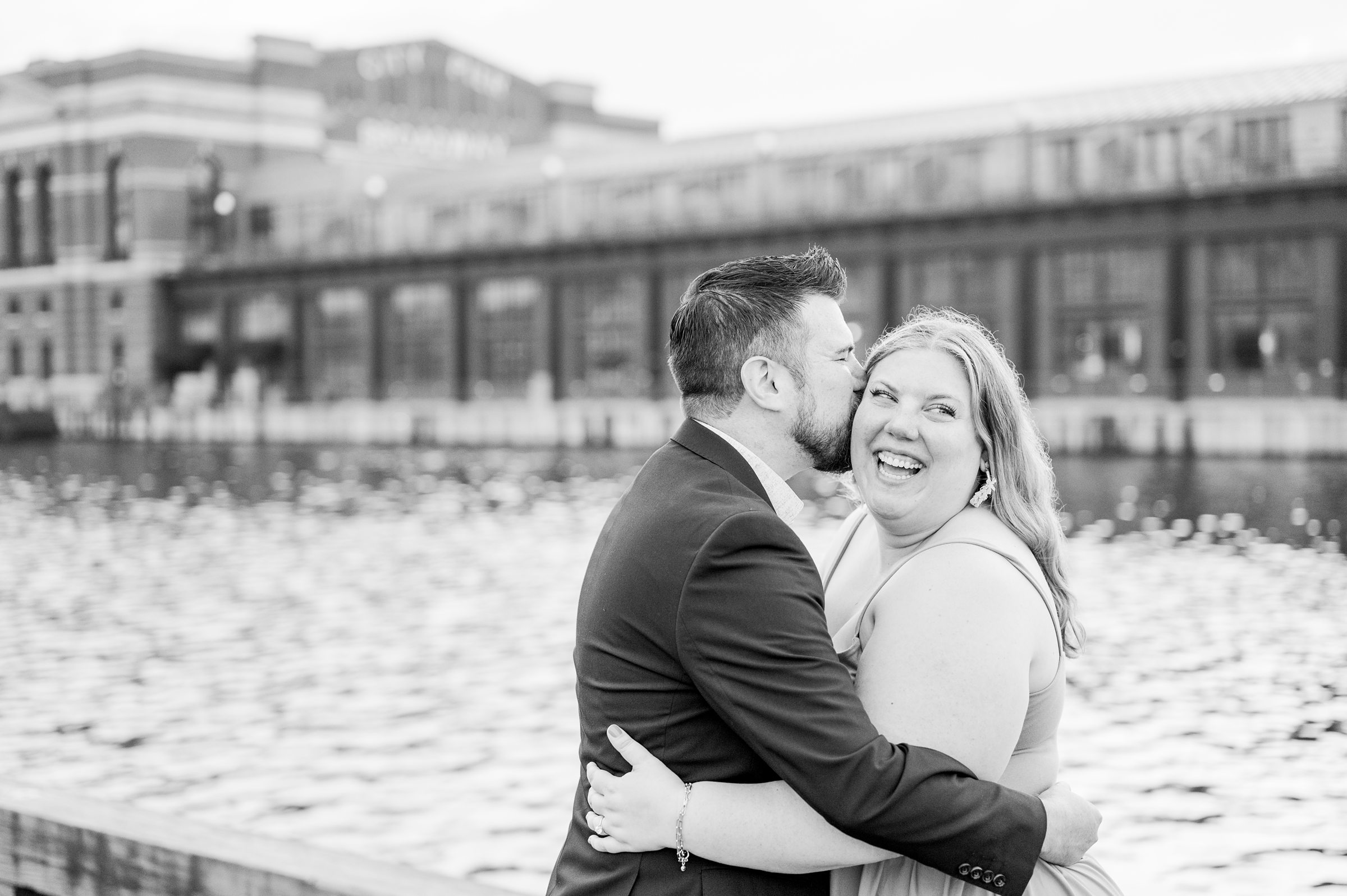 Engaged couple at Fells Point Waterfront for their sunrise engagement session in Baltimore, Maryland photographed by Baltimore Wedding Photographer Cait Kramer Photography.