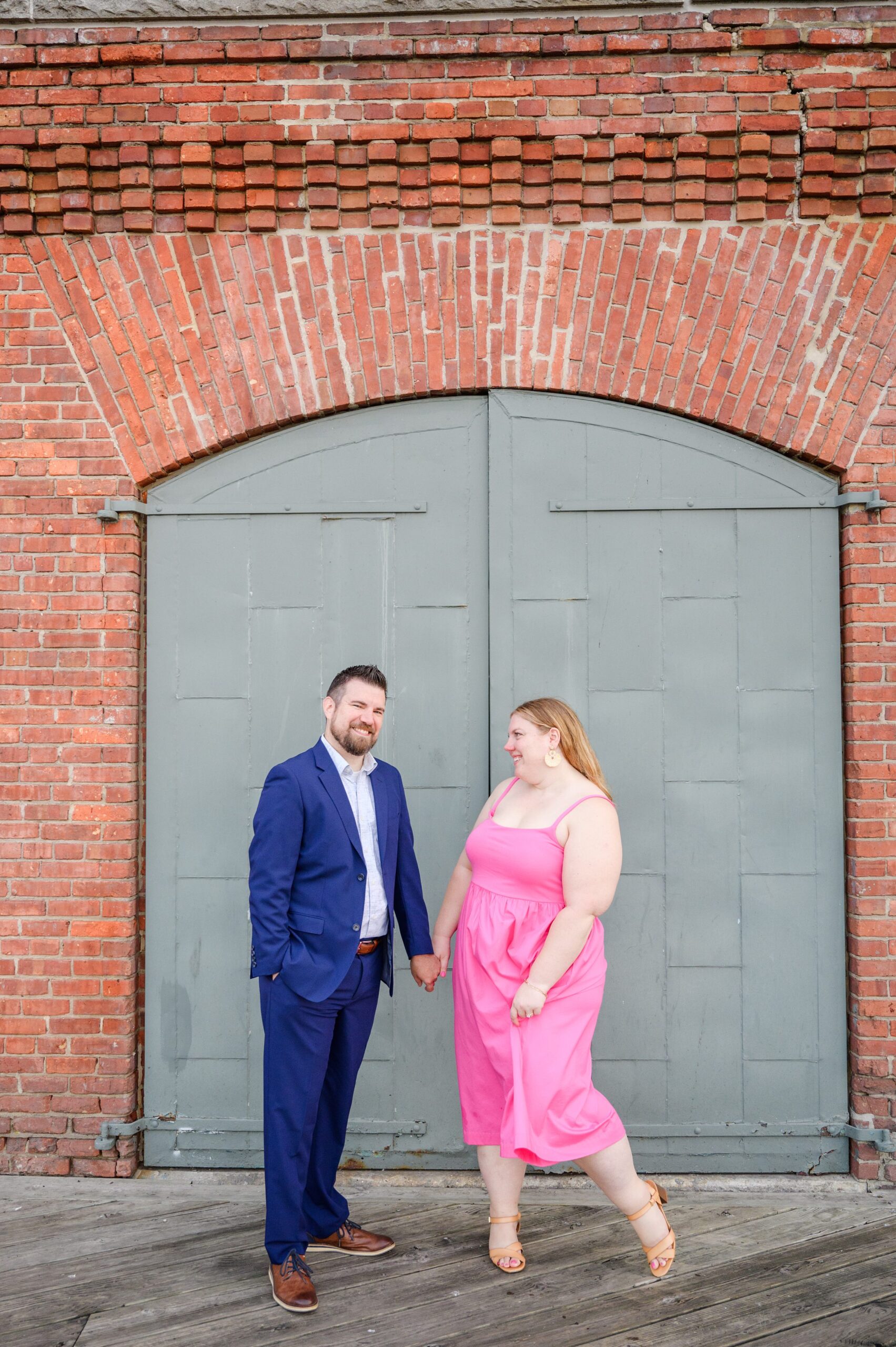 Engaged couple at Fells Point Waterfront for their sunrise engagement session in Baltimore, Maryland photographed by Baltimore Wedding Photographer Cait Kramer Photography.