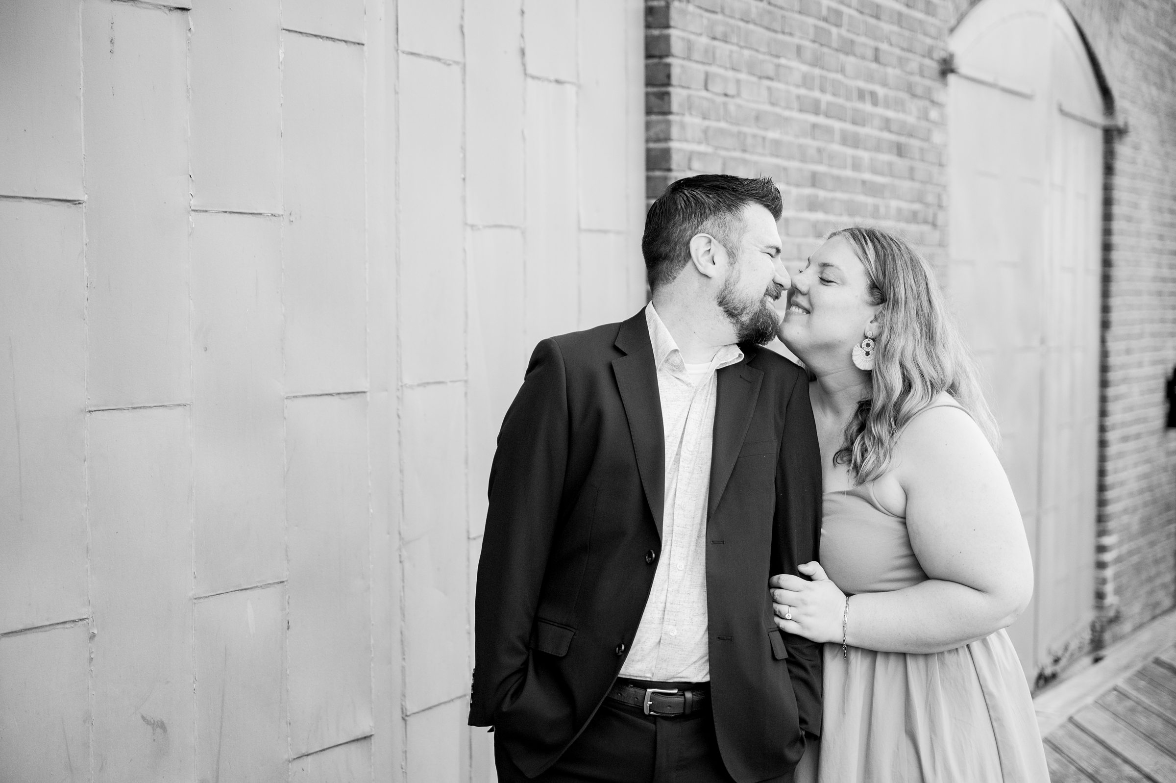 Engaged couple at Fells Point Waterfront for their sunrise engagement session in Baltimore, Maryland photographed by Baltimore Wedding Photographer Cait Kramer Photography.