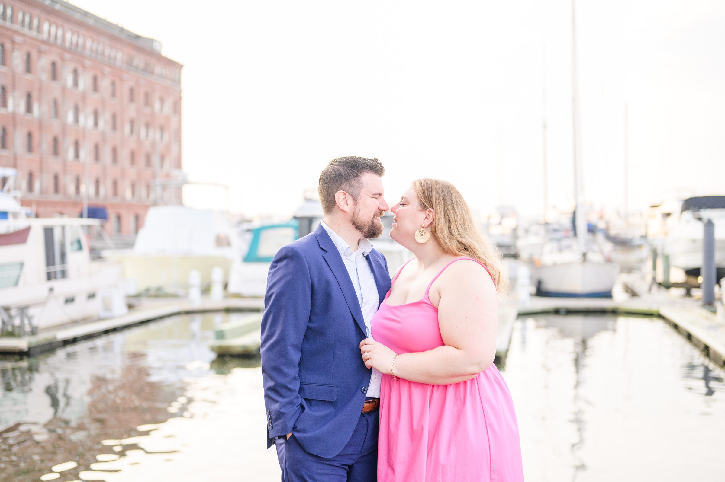 Engaged couple at Fells Point Waterfront for their sunrise engagement session in Baltimore, Maryland photographed by Baltimore Wedding Photographer Cait Kramer Photography.