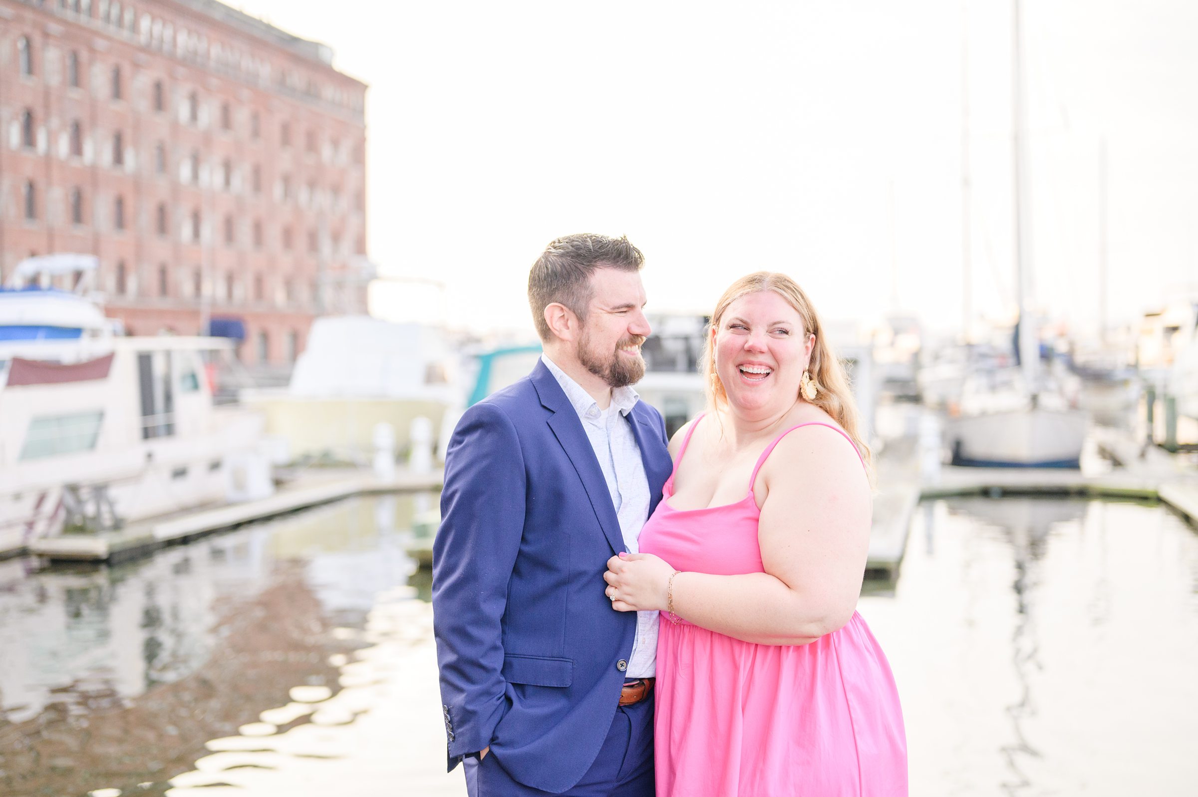 Engaged couple at Fells Point Waterfront for their sunrise engagement session in Baltimore, Maryland photographed by Baltimore Wedding Photographer Cait Kramer Photography.