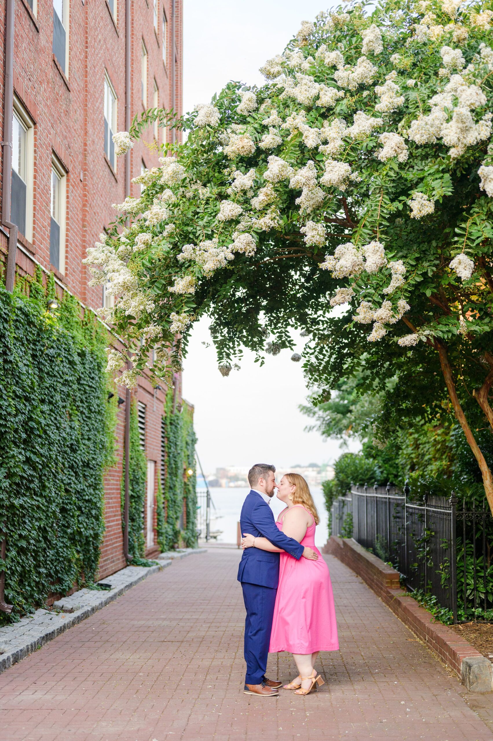 Engaged couple at Fells Point Waterfront for their sunrise engagement session in Baltimore, Maryland photographed by Baltimore Wedding Photographer Cait Kramer Photography.