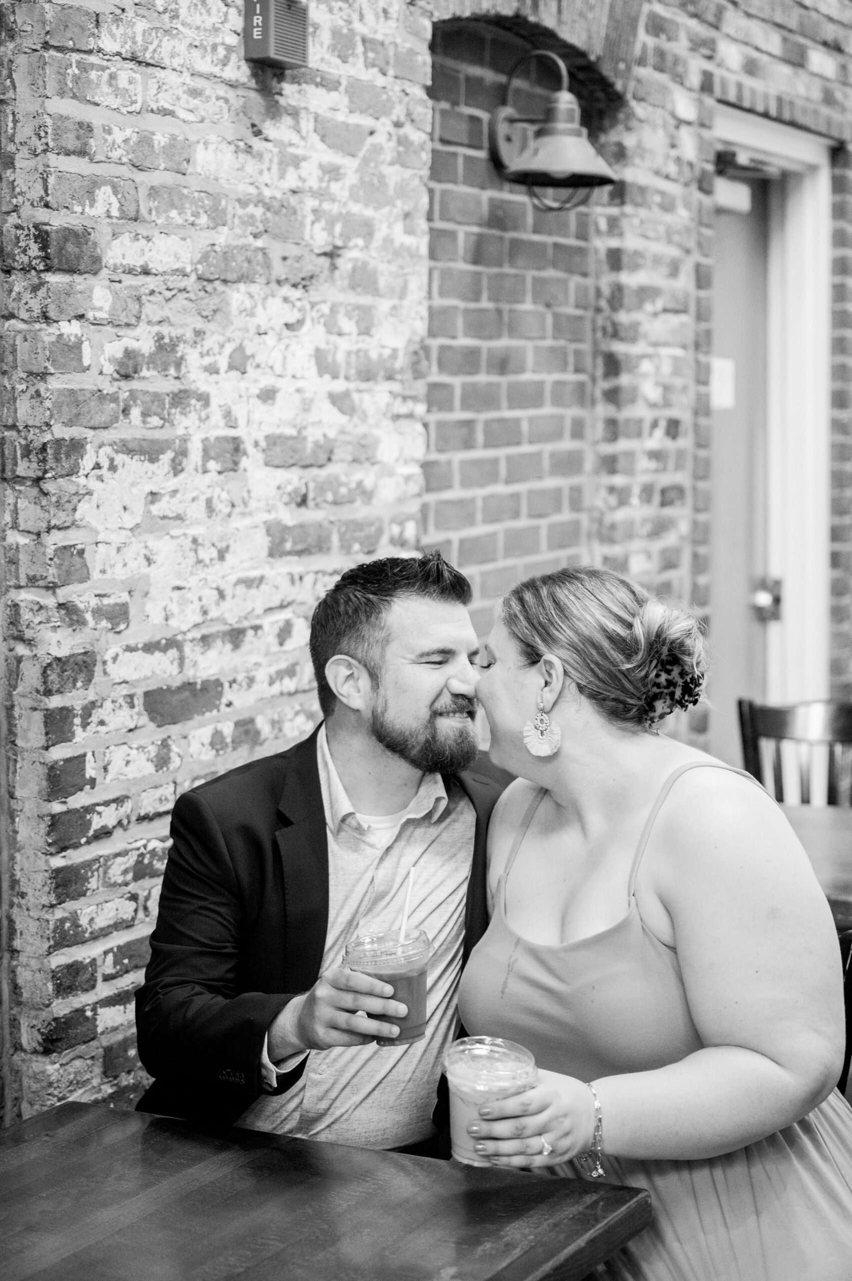 Engaged couple at Fells Point Waterfront for their sunrise engagement session in Baltimore, Maryland photographed by Baltimore Wedding Photographer Cait Kramer Photography.