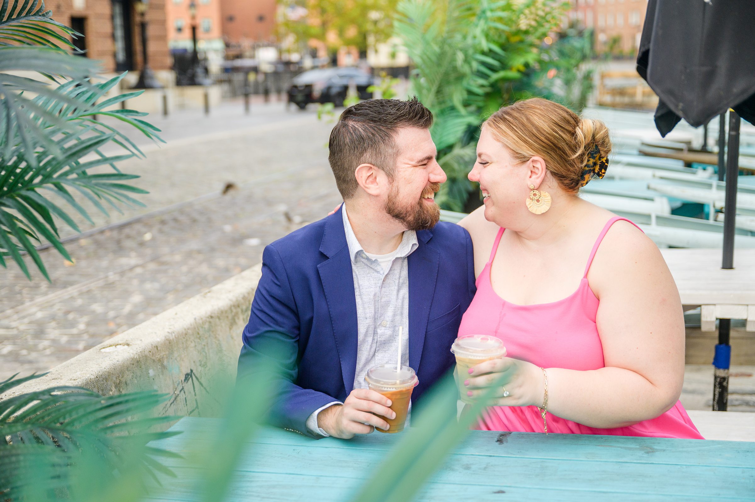 Engaged couple at Fells Point Waterfront for their sunrise engagement session in Baltimore, Maryland photographed by Baltimore Wedding Photographer Cait Kramer Photography.