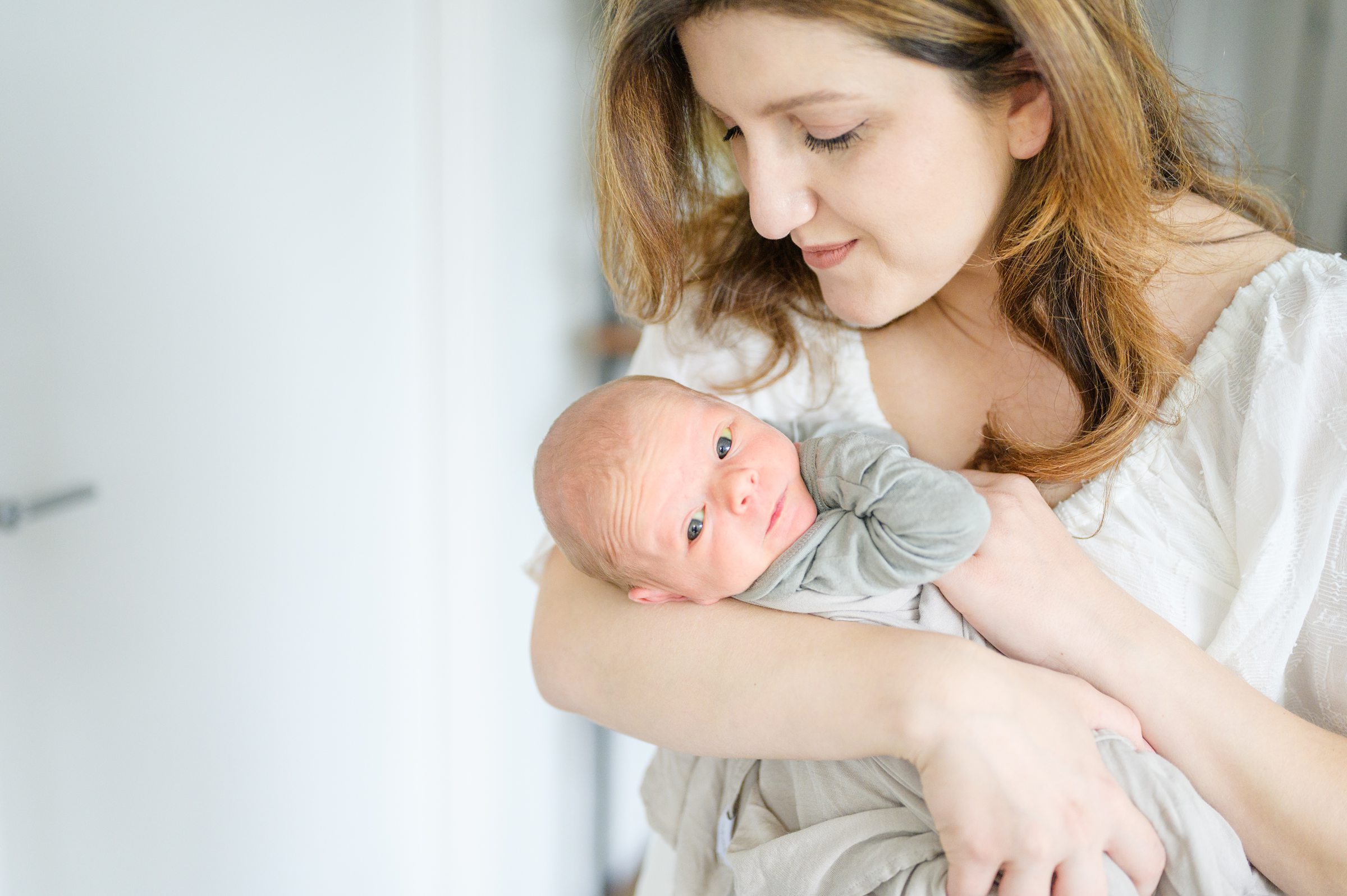 In-home newborn and family portrait session in Washington, D.C. photographed by Lifestyle Newborn Photographer Cait Kramer Photography.