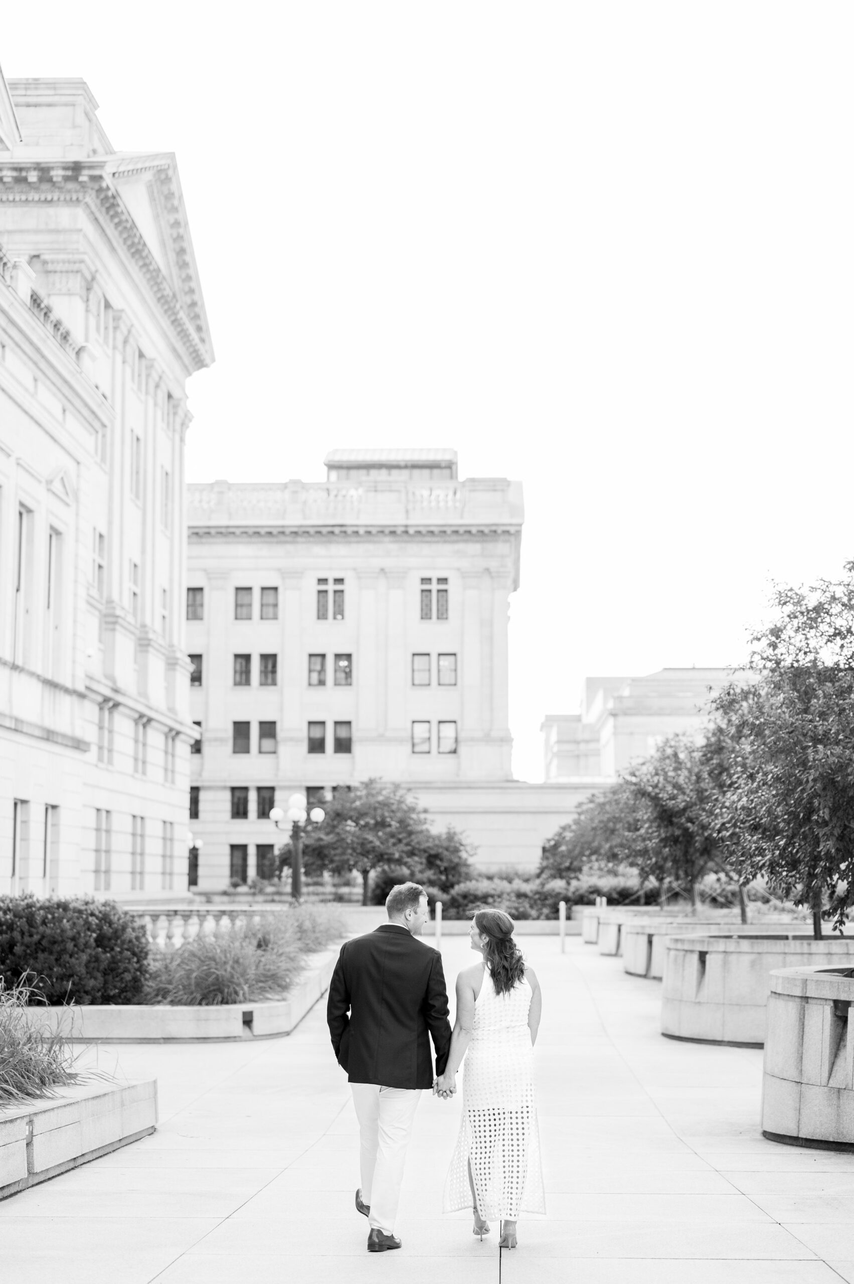 Engaged couple at the Pennsylvania State Capitol for their summer engagement session photographed by Baltimore Wedding Photographer Cait Kramer Photography.