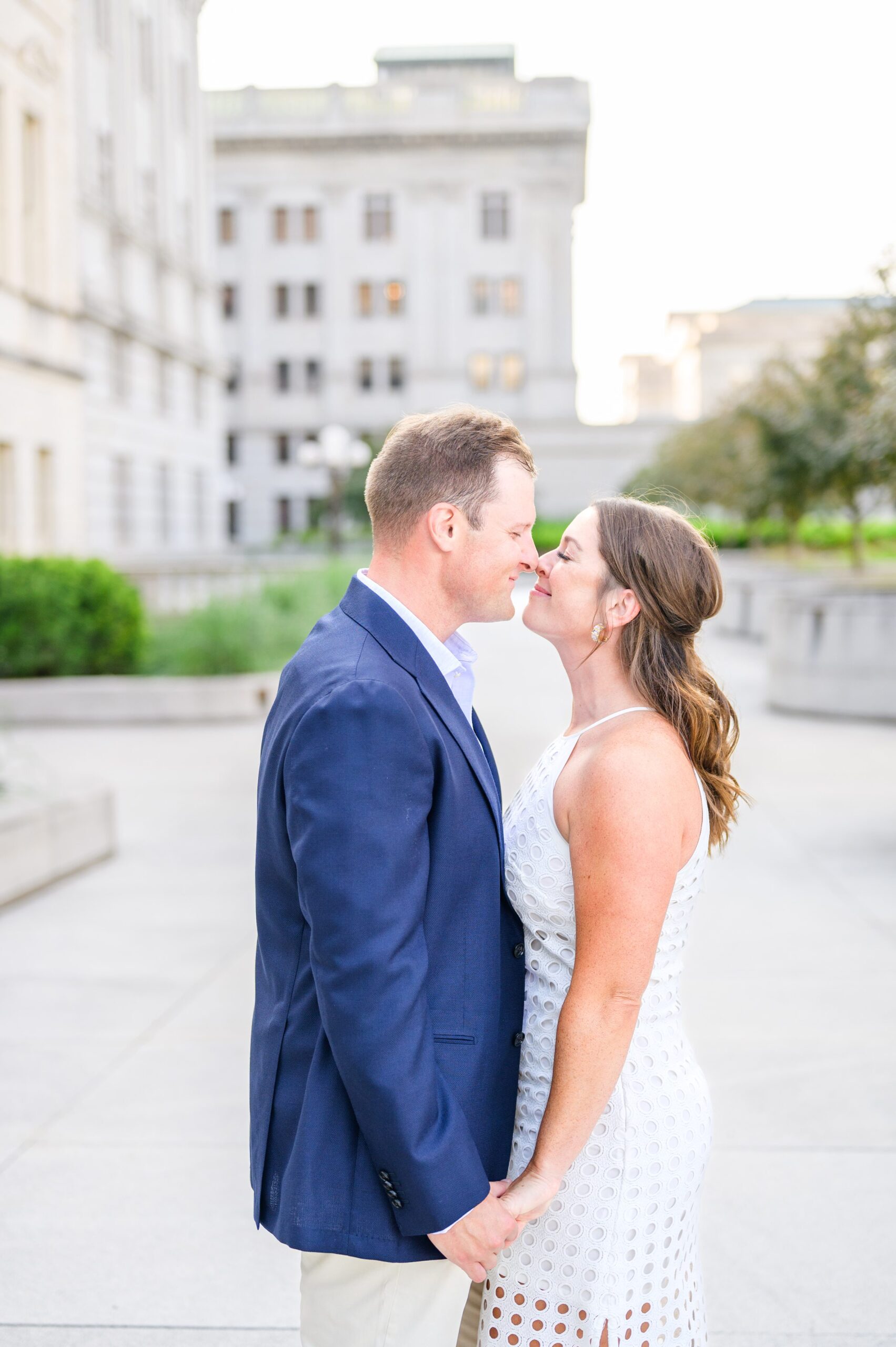 Engaged couple at the Pennsylvania State Capitol for their summer engagement session photographed by Baltimore Wedding Photographer Cait Kramer Photography.